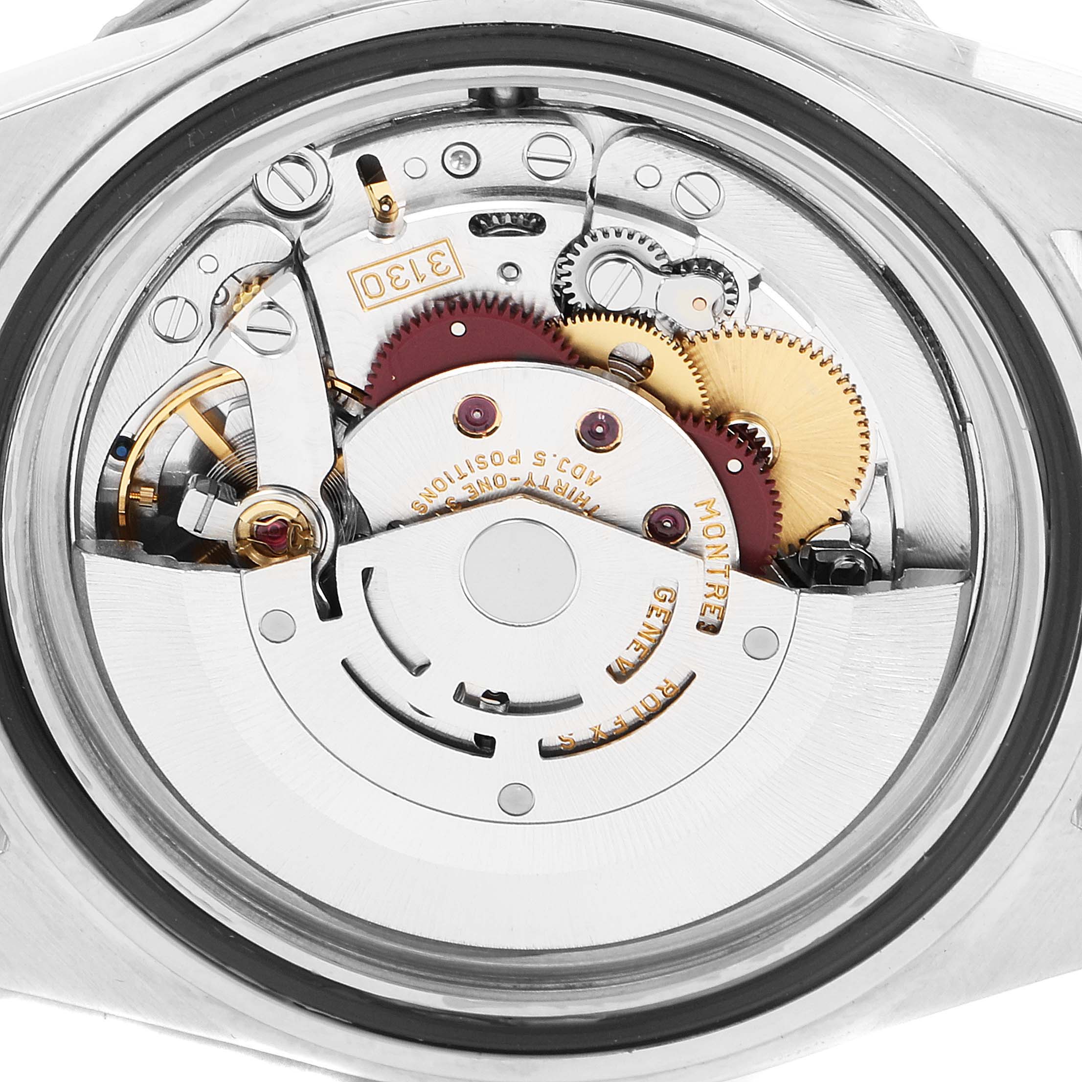 The image shows the open case back of a Rolex Submariner 14060 Men's Stainless Steel Black Dial 14060 Men's Stainless Steel Black Dial, revealing its intricate mechanical movement components.