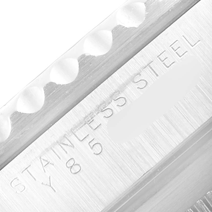 This close-up image shows the side view of a Rolex Submariner 14060 Men's Stainless Steel Black Dial 14060 Men's Stainless Steel Black Dial, highlighting the stainless steel material and part of the watch bezel.