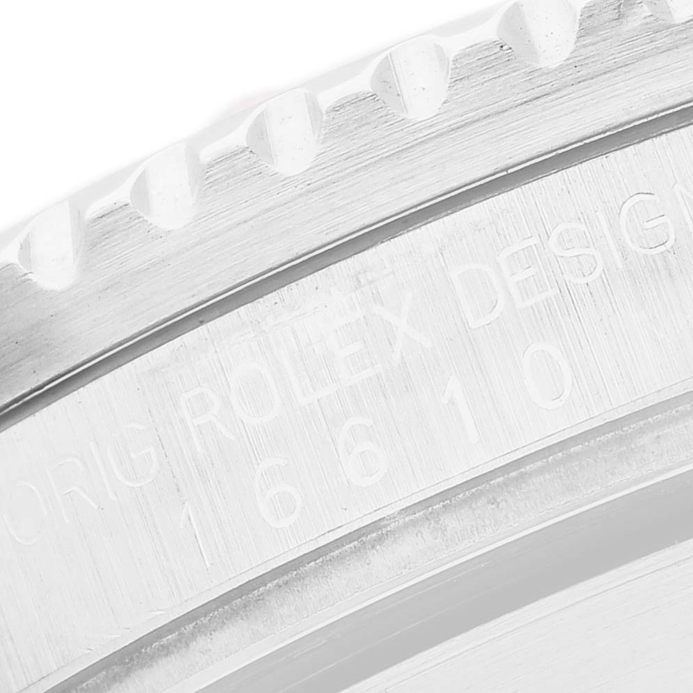 The image shows a close-up of the engraved side of the bezel and case on a Rolex Submariner 16610 Men's Stainless Steel Black Dial.