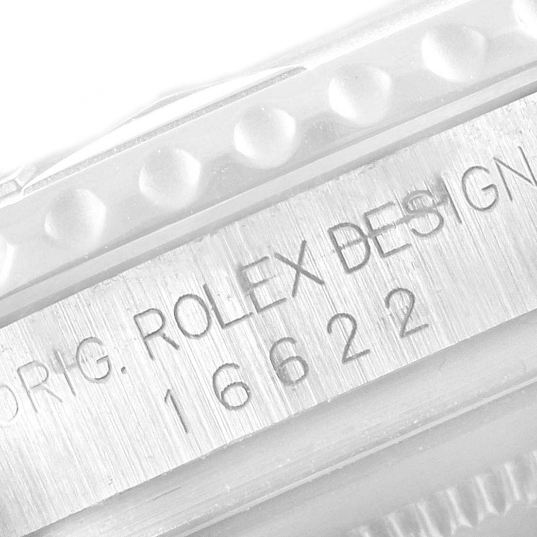 The image shows a close-up of the model number and design details on the side of the bezel of a Rolex Yacht-Master 16622 Men's Stainless Steel Silver Dial 16622 Men's Stainless Steel Silver Dial watch.