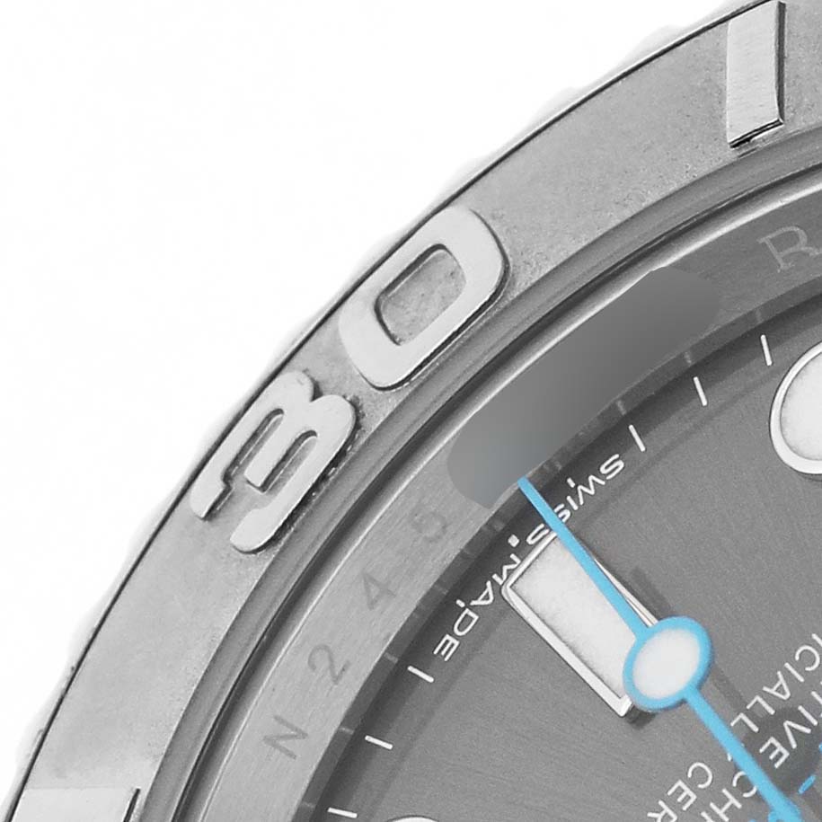 The image shows a close-up of the Rolex Yacht-Master 116622 Men's Stainless Steel Silver Dial's bezel and part of the dial, including the minute hand and hour markers.