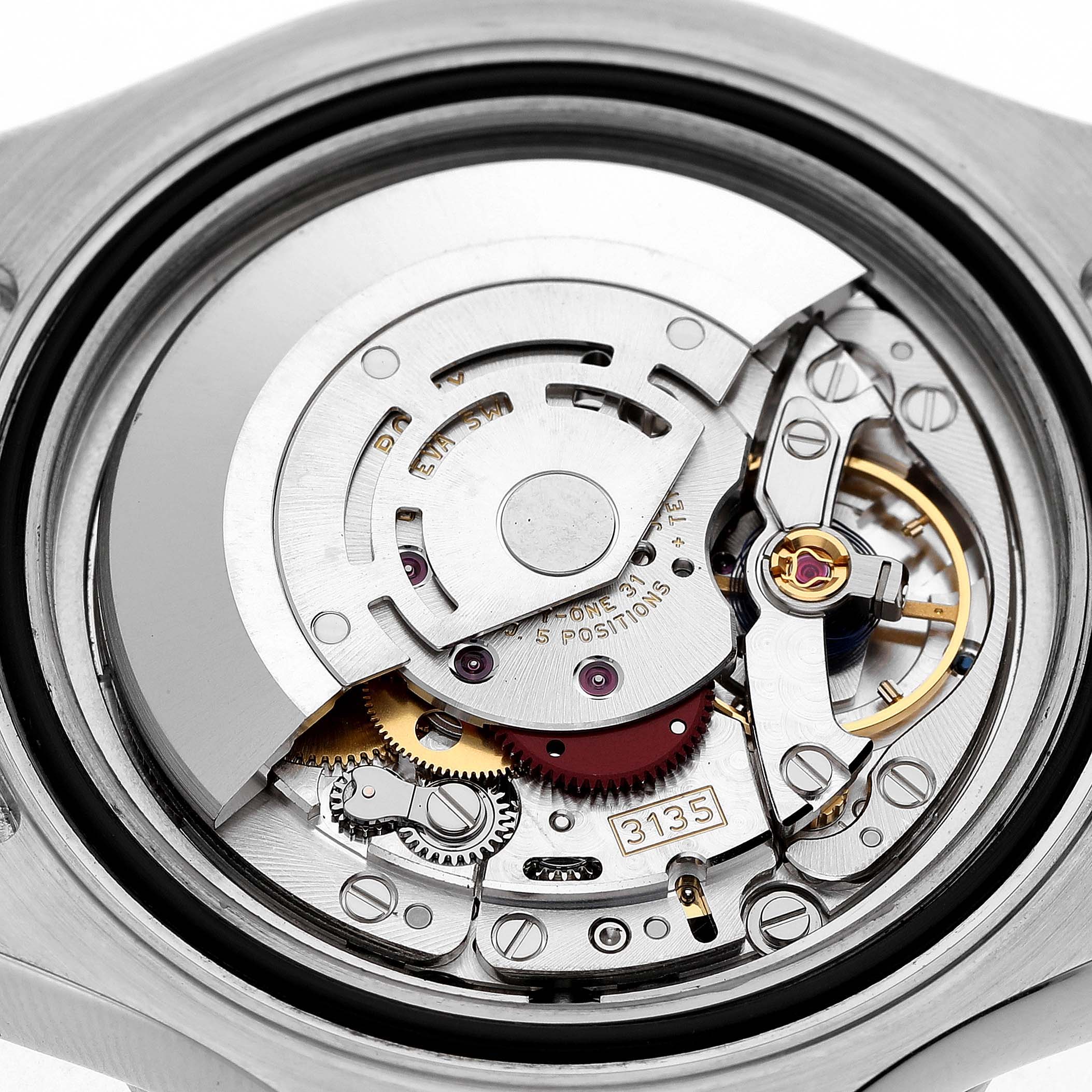 The image shows the internal mechanism of a Rolex Yacht-Master 116622 Men's Stainless Steel Silver Dial watch, highlighting its movement components from the back.