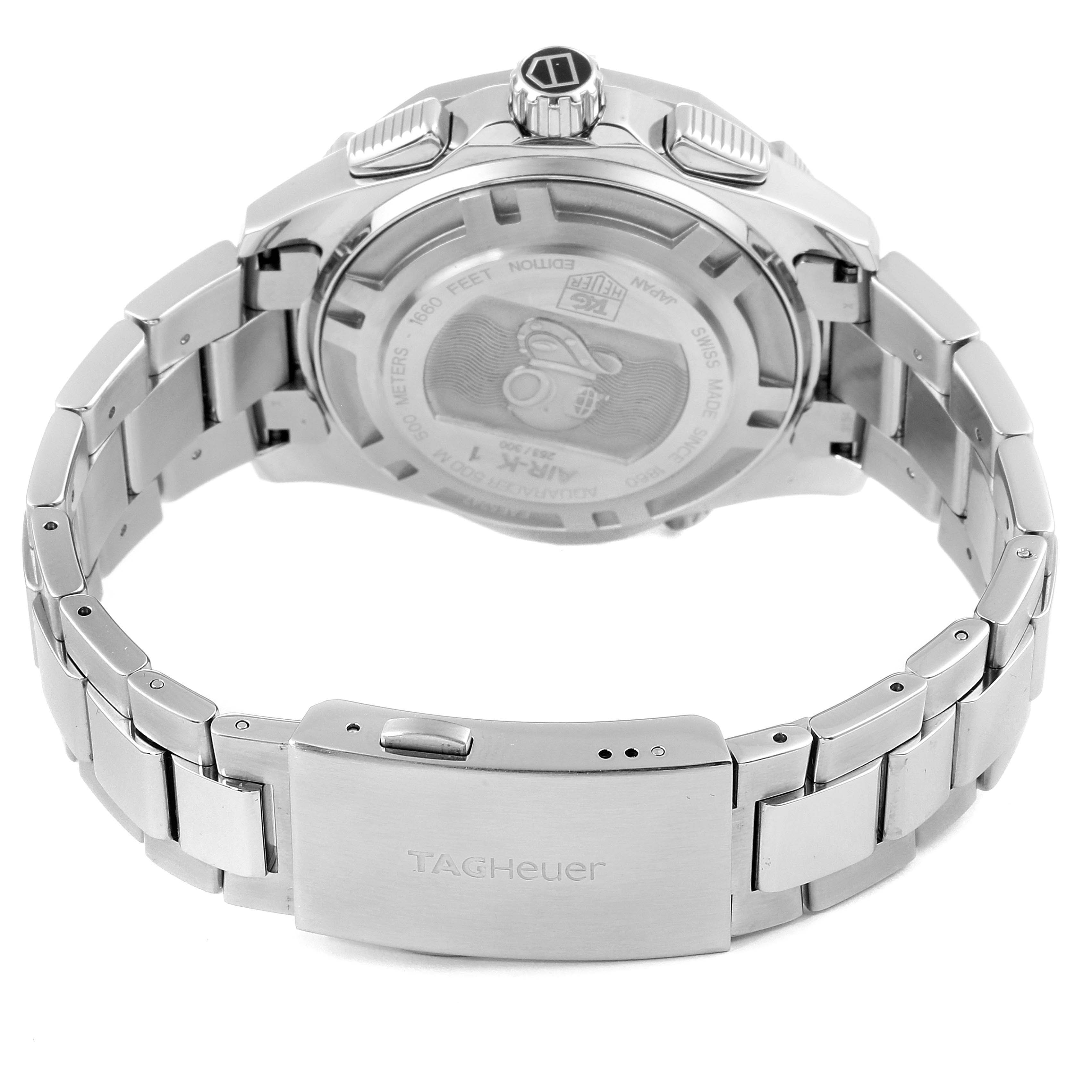The image shows the back case and clasp of a Tag Heuer Aquaracer watch, highlighting the watch
s stainless steel bracelet and case back design.