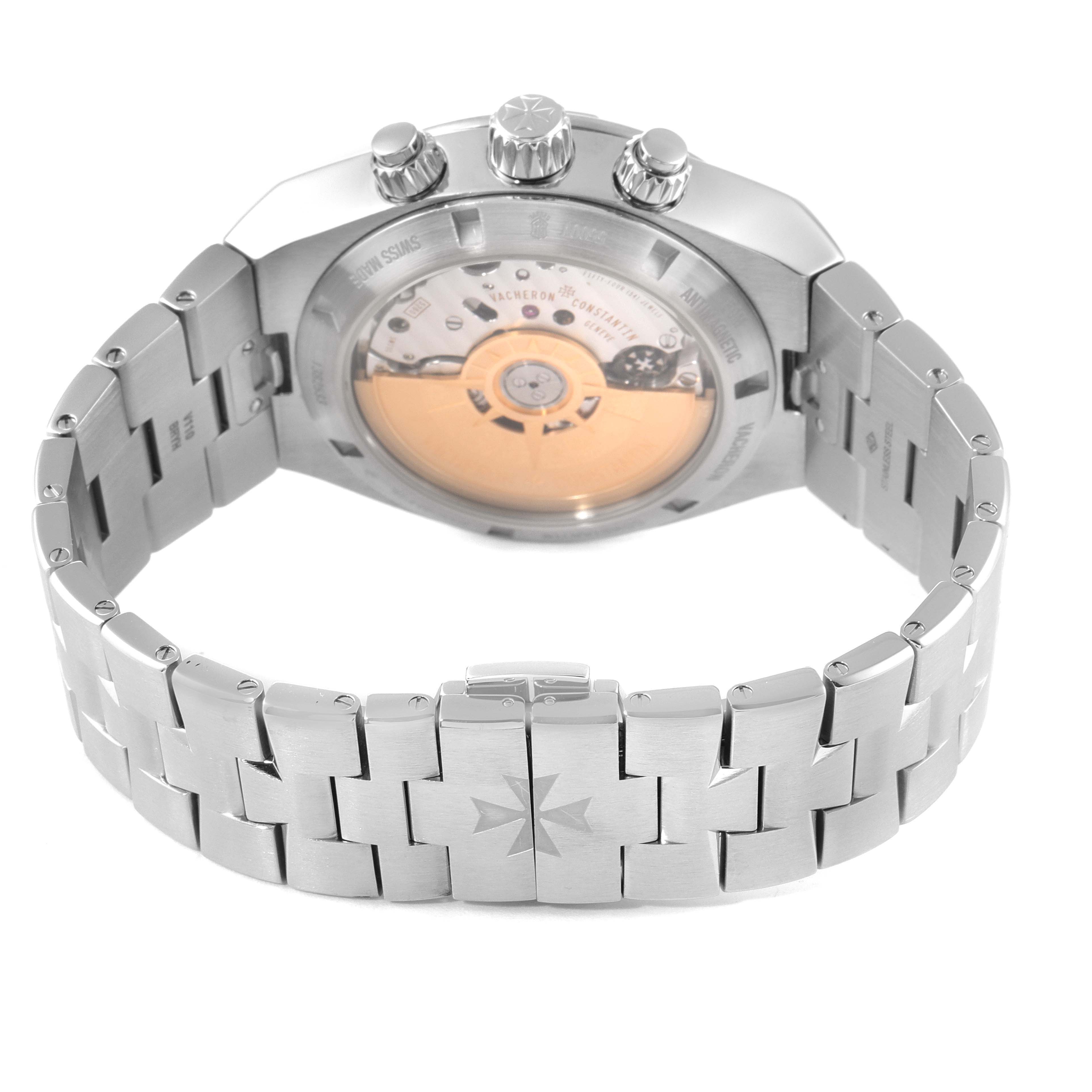 The image shows the back of a Vacheron Constantin Overseas 5500V/110A-B148 Men's Stainless Steel Blue Dial 5500V/110A-B148 Men's Stainless Steel Blue Dial watch, highlighting its stainless steel bracelet and transparent case back displaying the movement.