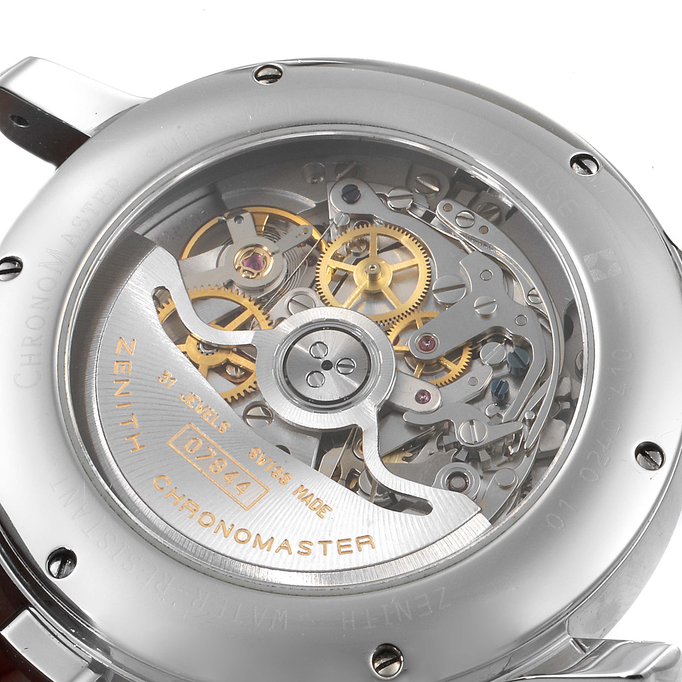 The image shows the back view of the Zenith Chronomaster 01.0240.410 Men's Stainless Steel Silver Dial 01.0240.410 Men's Stainless Steel Silver Dial watch, revealing its intricate movement and mechanical parts.