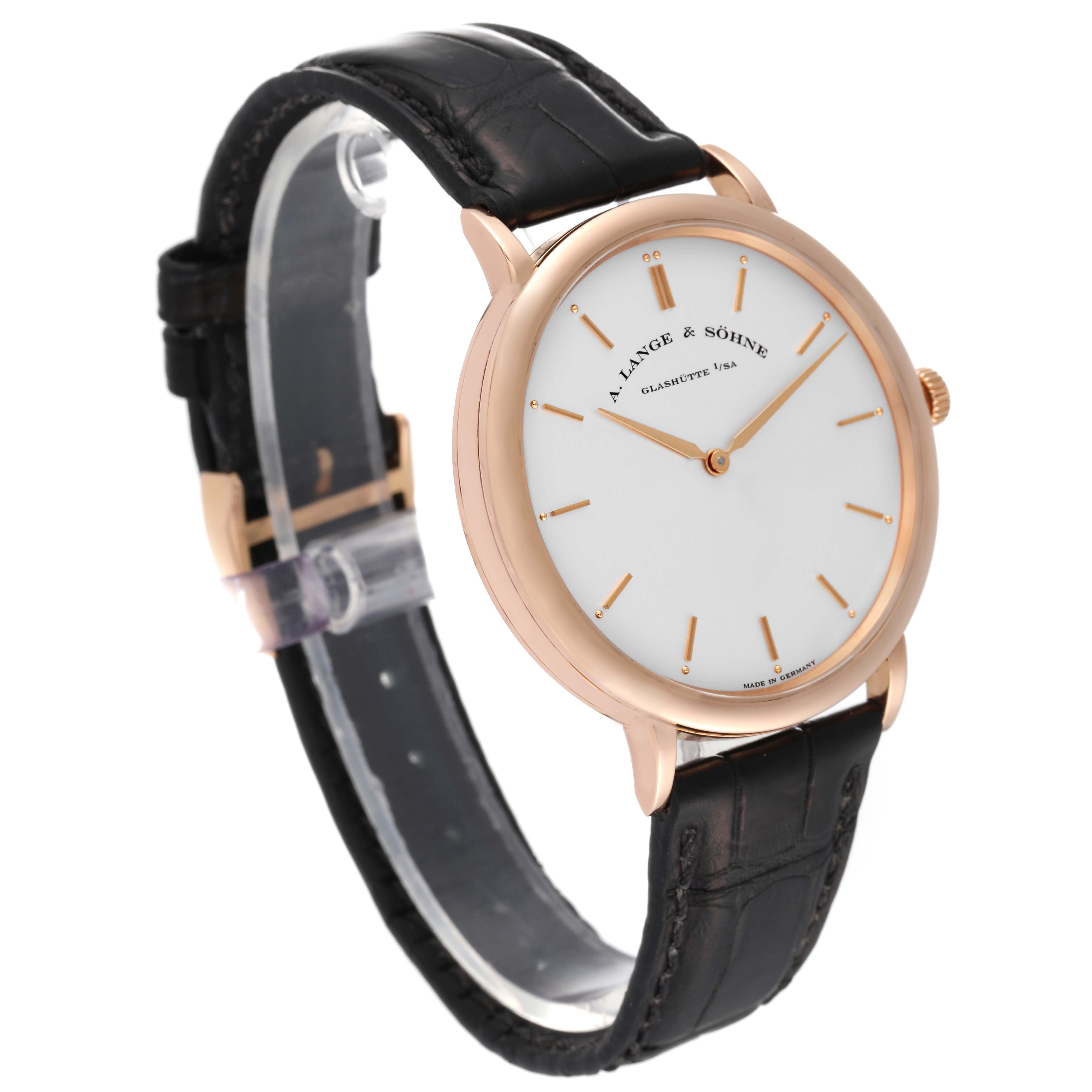 The image shows a Saxonia model by A. Lange & Söhne at a three-quarter angle, highlighting the watch face, case, and black leather strap.