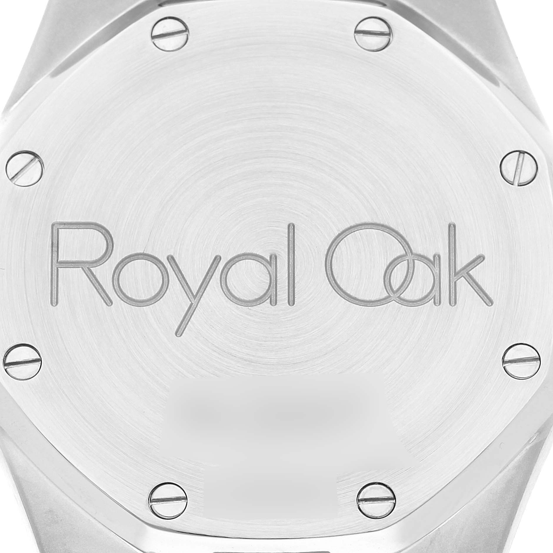 The image shows the back case of a Royal Oak watch by Audemars Piguet, featuring engravings and screws.