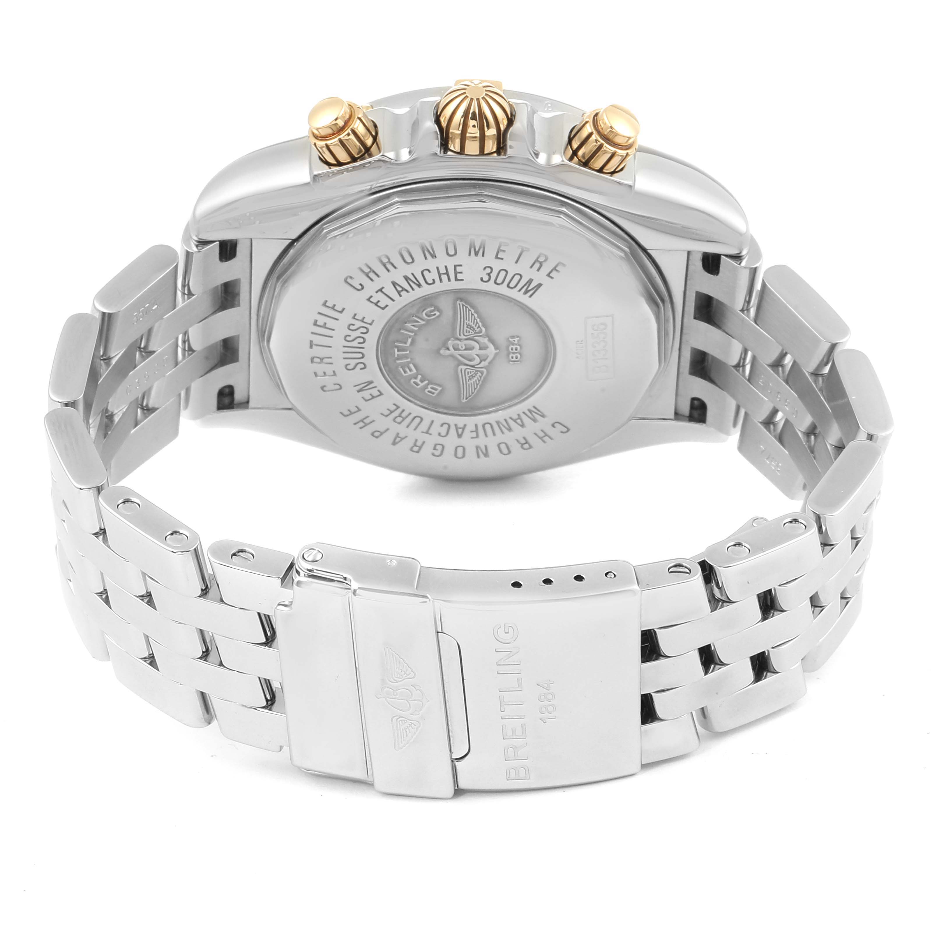 The image shows the back, crown, and part of the bracelet of the Breitling Chronomat B13356 Men's Steel and Gold (two tone) Black Dial B13356 Men's Steel and Gold (two tone) Black Dial watch.