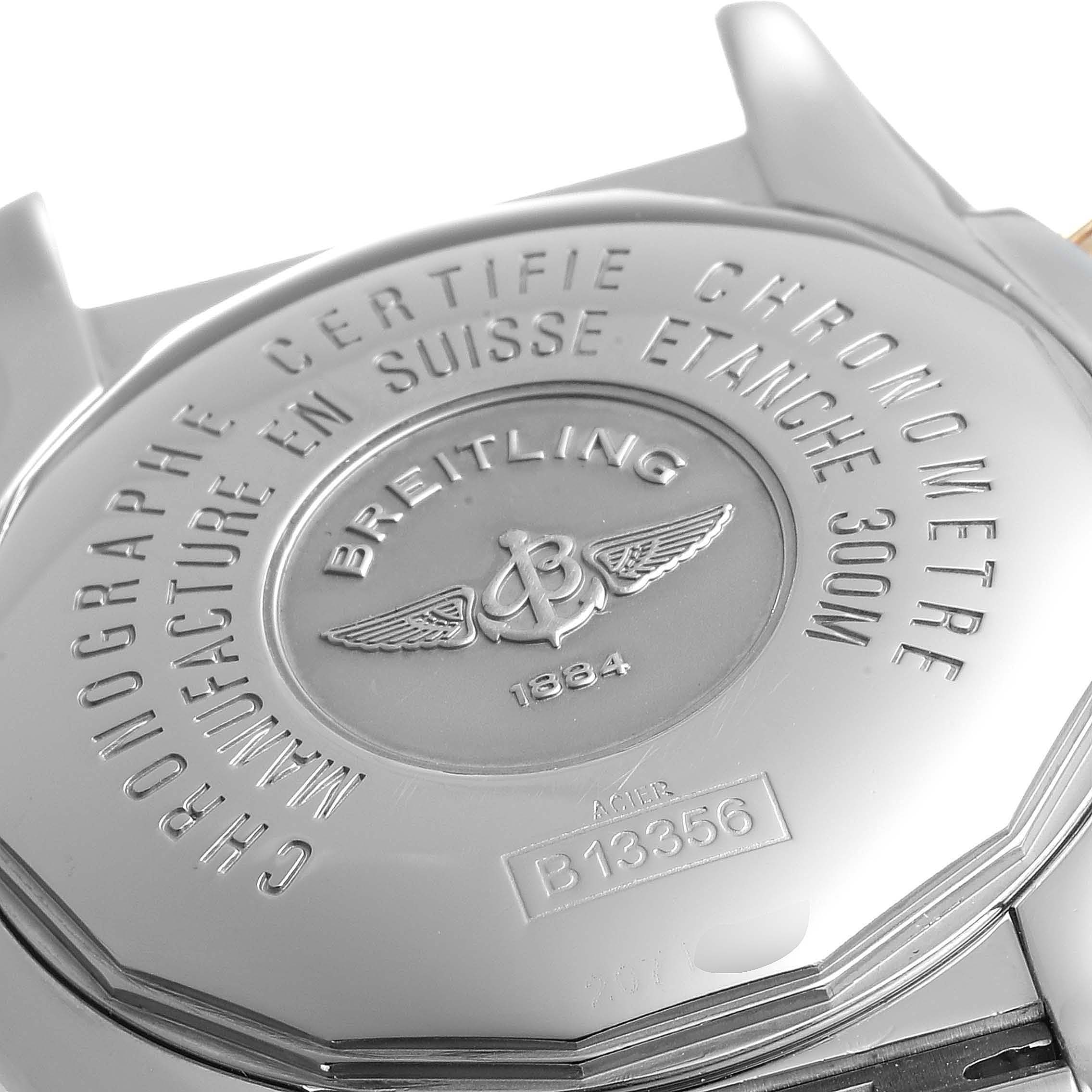 The image shows the back case of a Breitling Chronomat B13356 Men's Steel and Gold (two tone) Black Dial B13356 Men's Steel and Gold (two tone) Black Dial watch, highlighting its engravings and branding.
