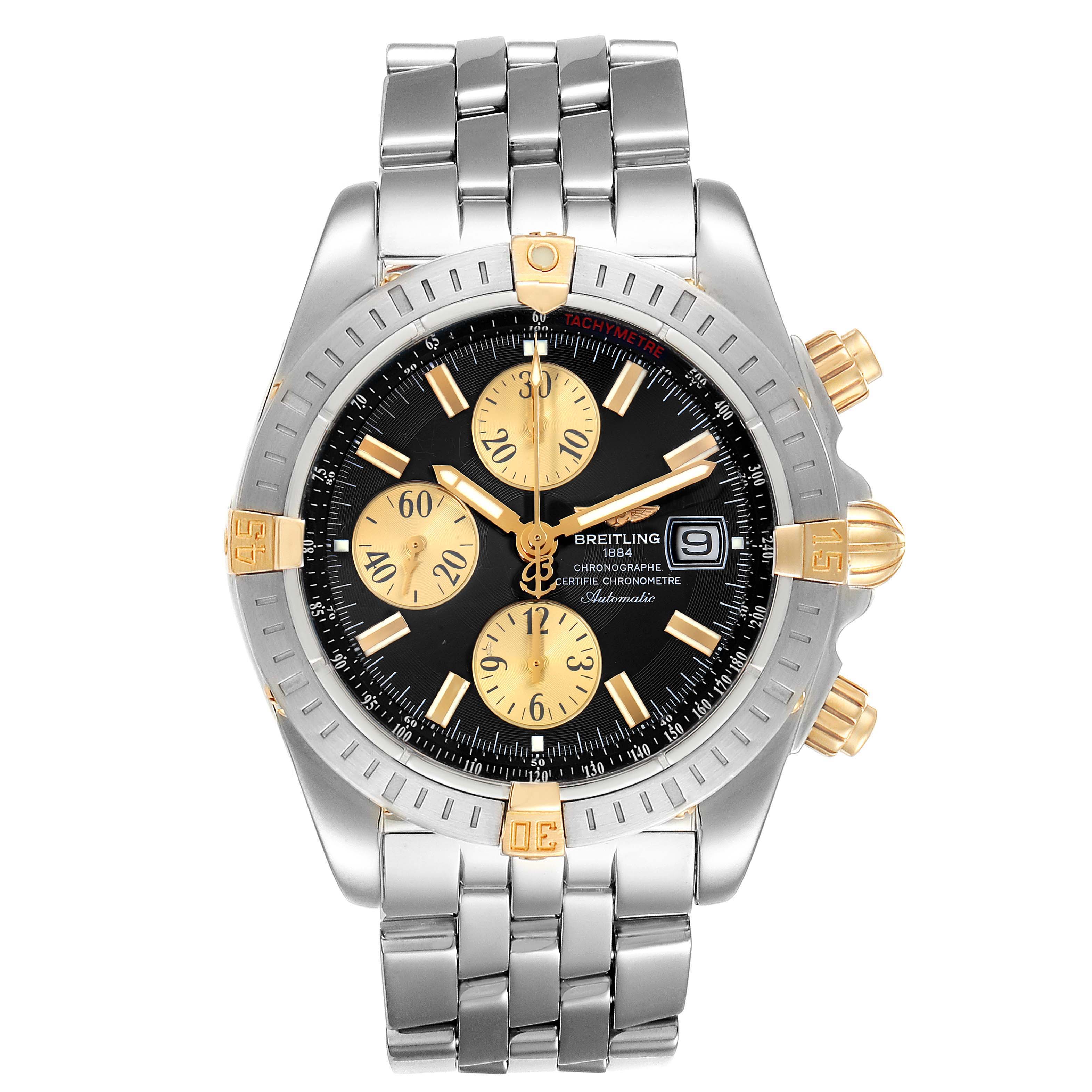 The image shows a front view of a Breitling Chronomat B13356 Men's Steel and Gold (two tone) Black Dial B13356 Men's Steel and Gold (two tone) Black Dial watch, highlighting its black dial, gold sub-dials, and silver bracelet.