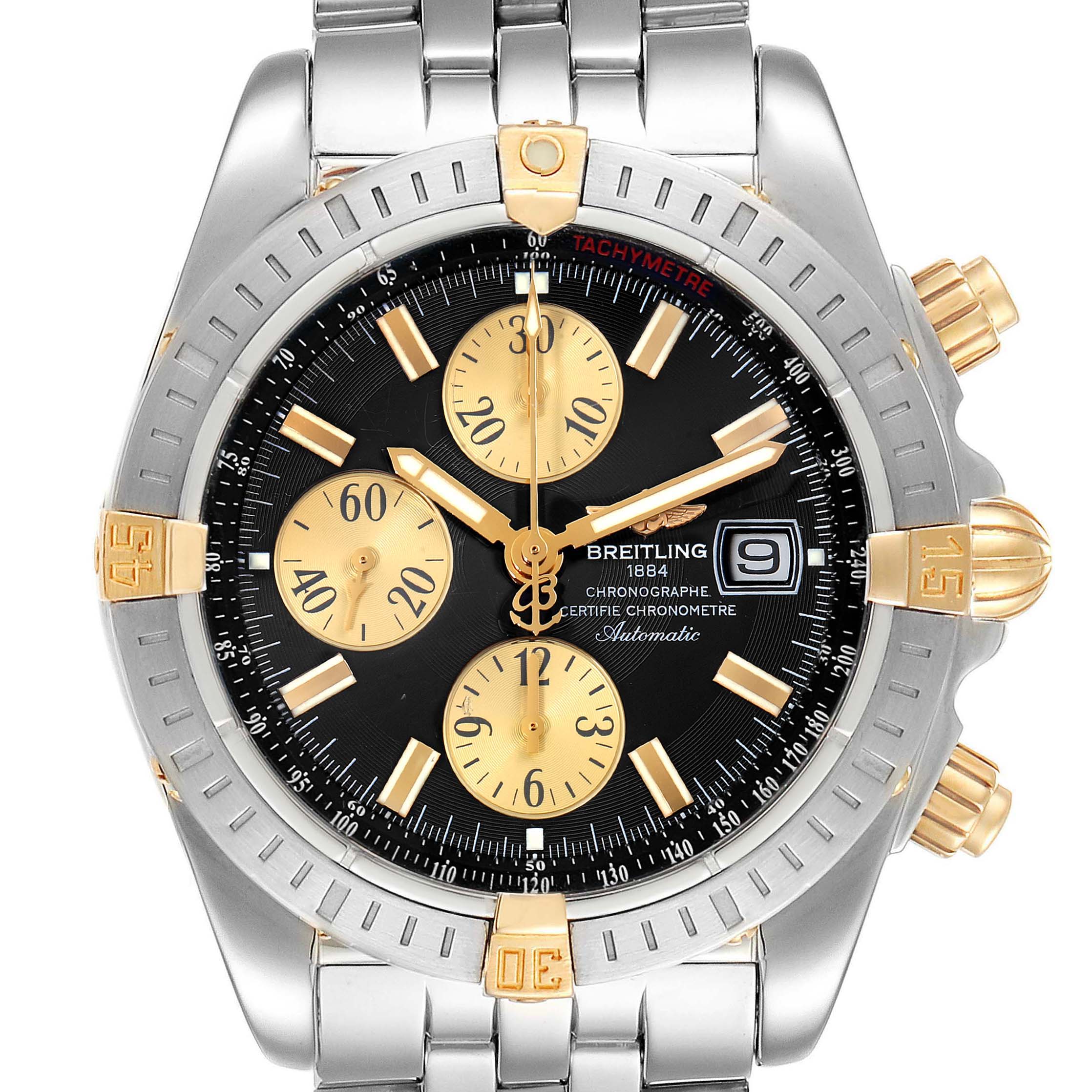 The image shows a front view of a Breitling Chronomat B13356 Men's Steel and Gold (two tone) Black Dial B13356 Men's Steel and Gold (two tone) Black Dial watch, highlighting its black dial, gold subdials, and stainless steel and gold bezel.