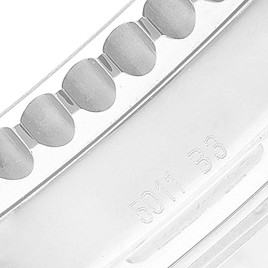 The image shows a close-up of the bezel and edge of the casing of a Breitling Navitimer AB0120 Men
s Stainless Steel Black Dial AB0120 Men
s Stainless Steel Black Dial watch.