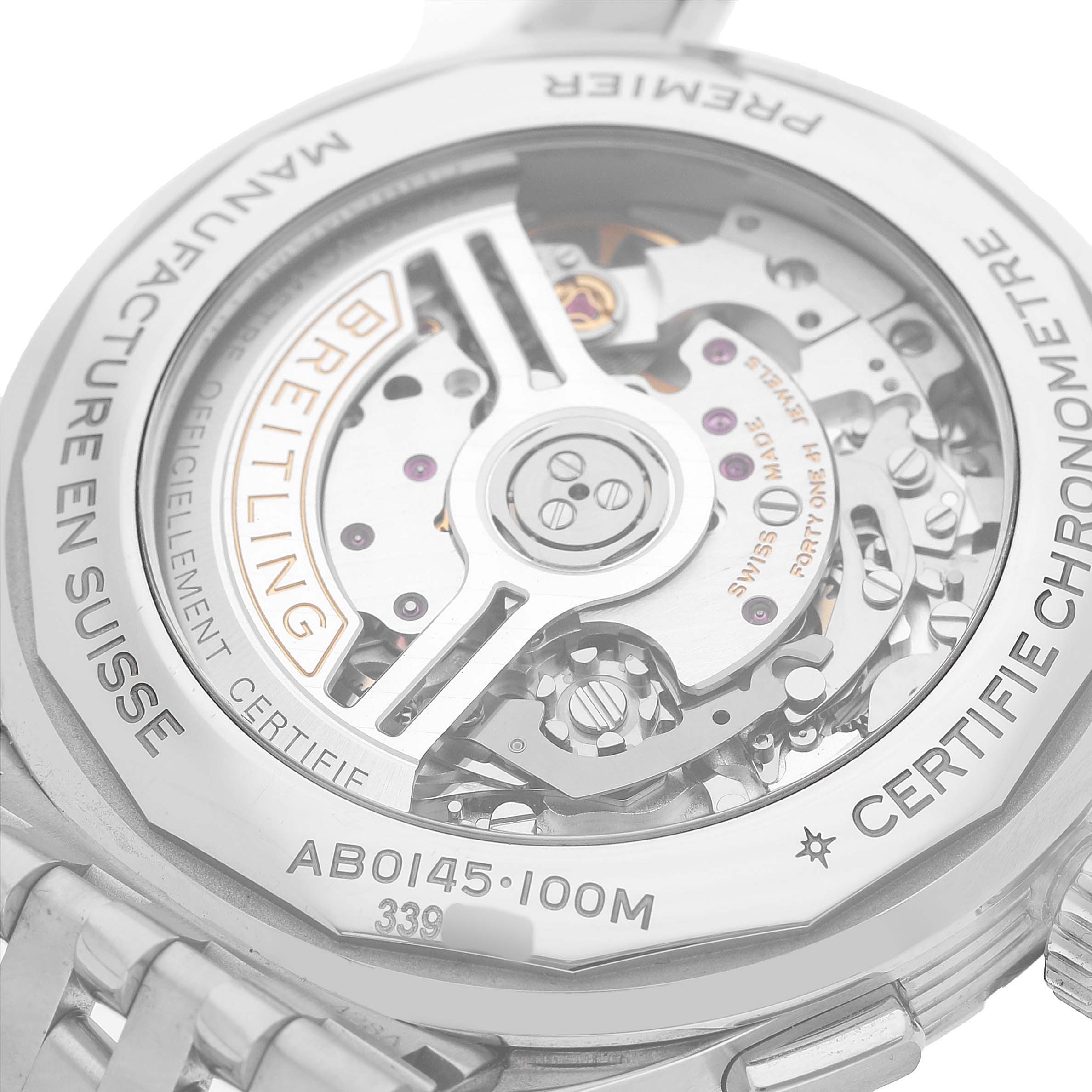 The image shows the back of a Breitling Premier AB0145 Men's Stainless Steel Green Dial watch, highlighting its movement and inscriptions on the case back.