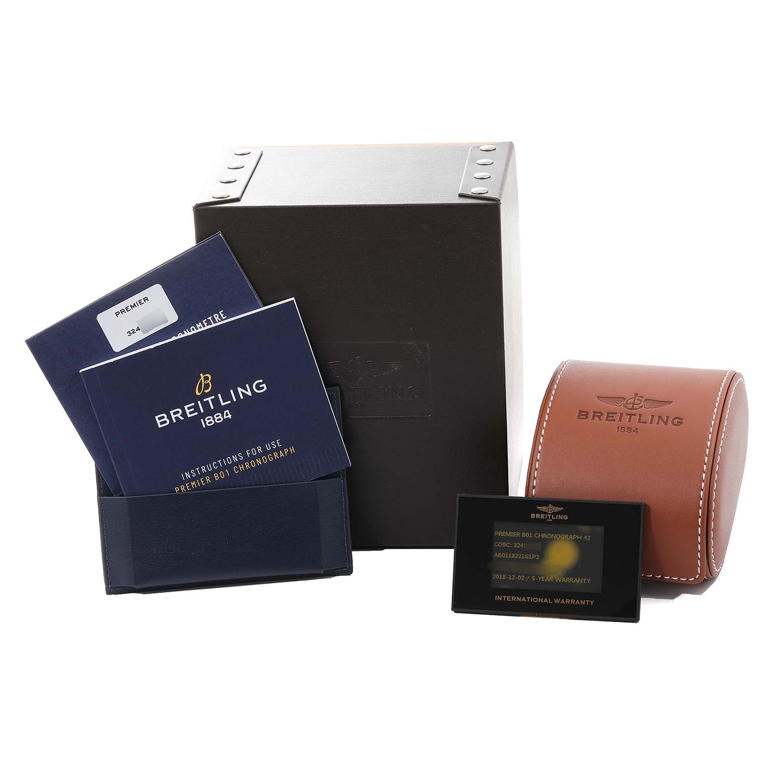 The image shows the Breitling Premier AB0118221G1P2 Men's Stainless Steel Silver Dial AB0118221G1P2 Men's Stainless Steel Silver Dial model watch accessories, including the box, manuals, leather case, and warranty card, from a front angle.
