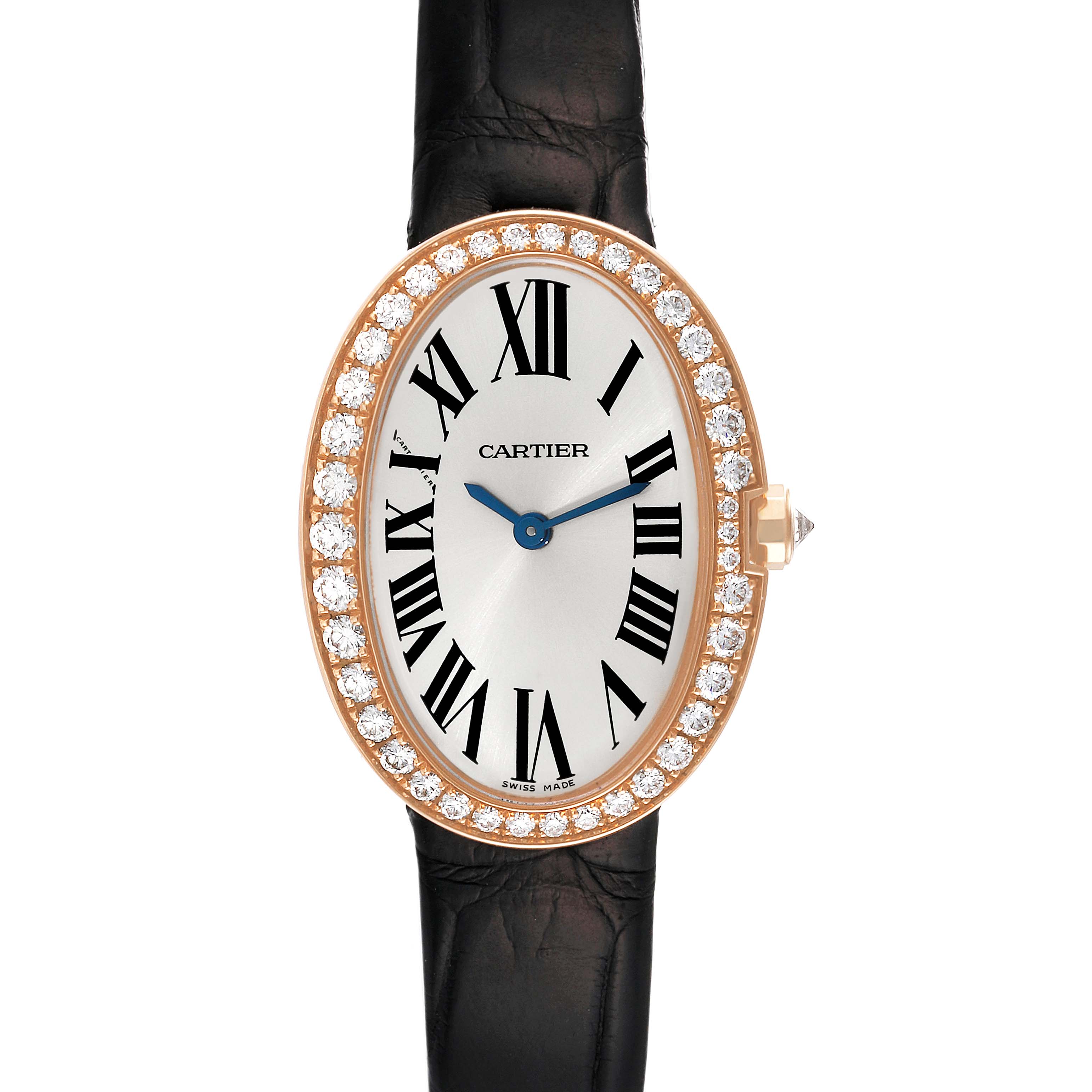 The Cartier Baignoire WB520004 Women's Rose Gold Silver Dial WB520004 Women's Rose Gold Silver Dial watch is shown from a front view, highlighting its oval face, Roman numerals, diamond bezel, and black strap.