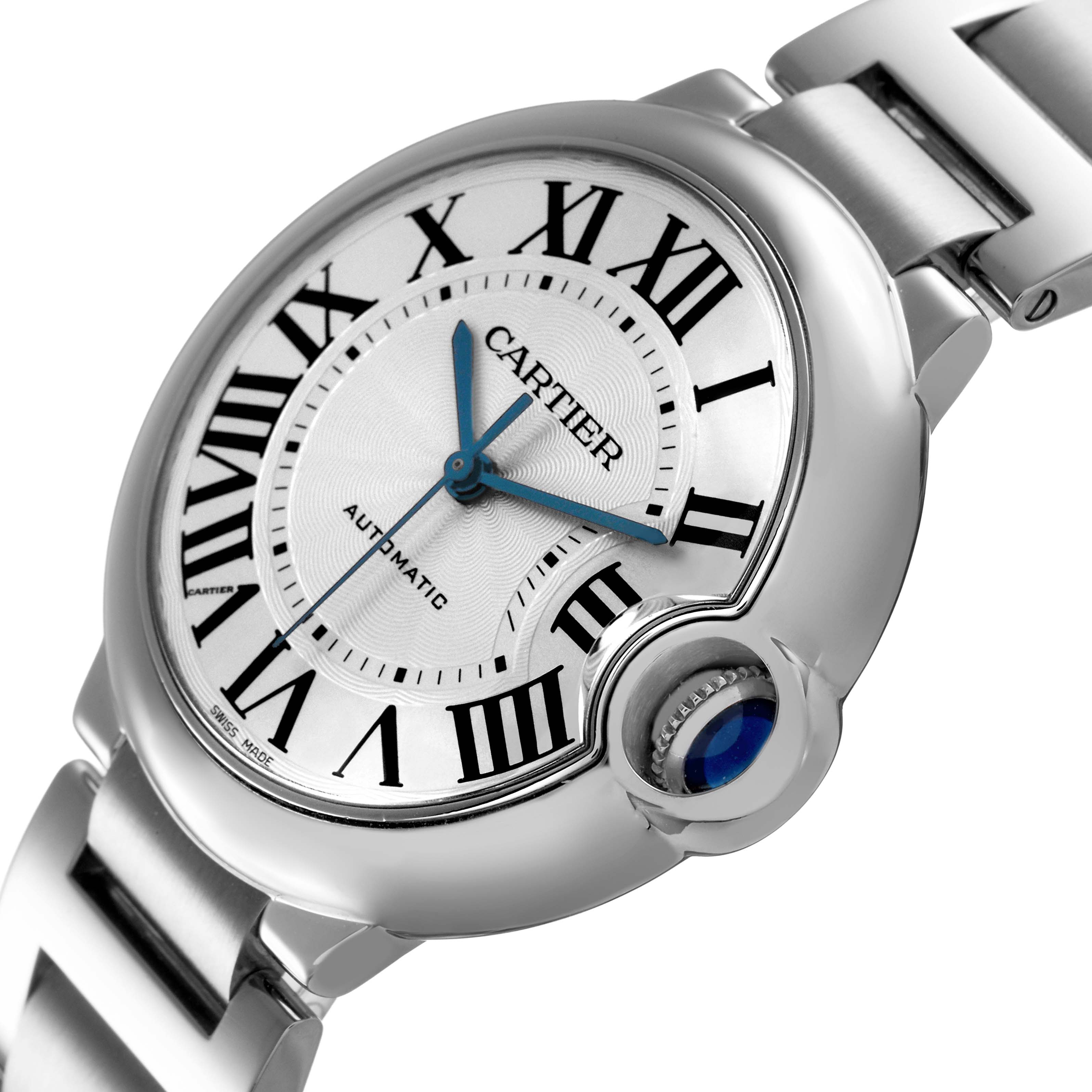 The Cartier Ballon Bleu W6920046 Women's Stainless Steel Silver Dial watch is shown at an angle highlighting the face, Roman numerals, blue hands, and crown with a blue cabochon.