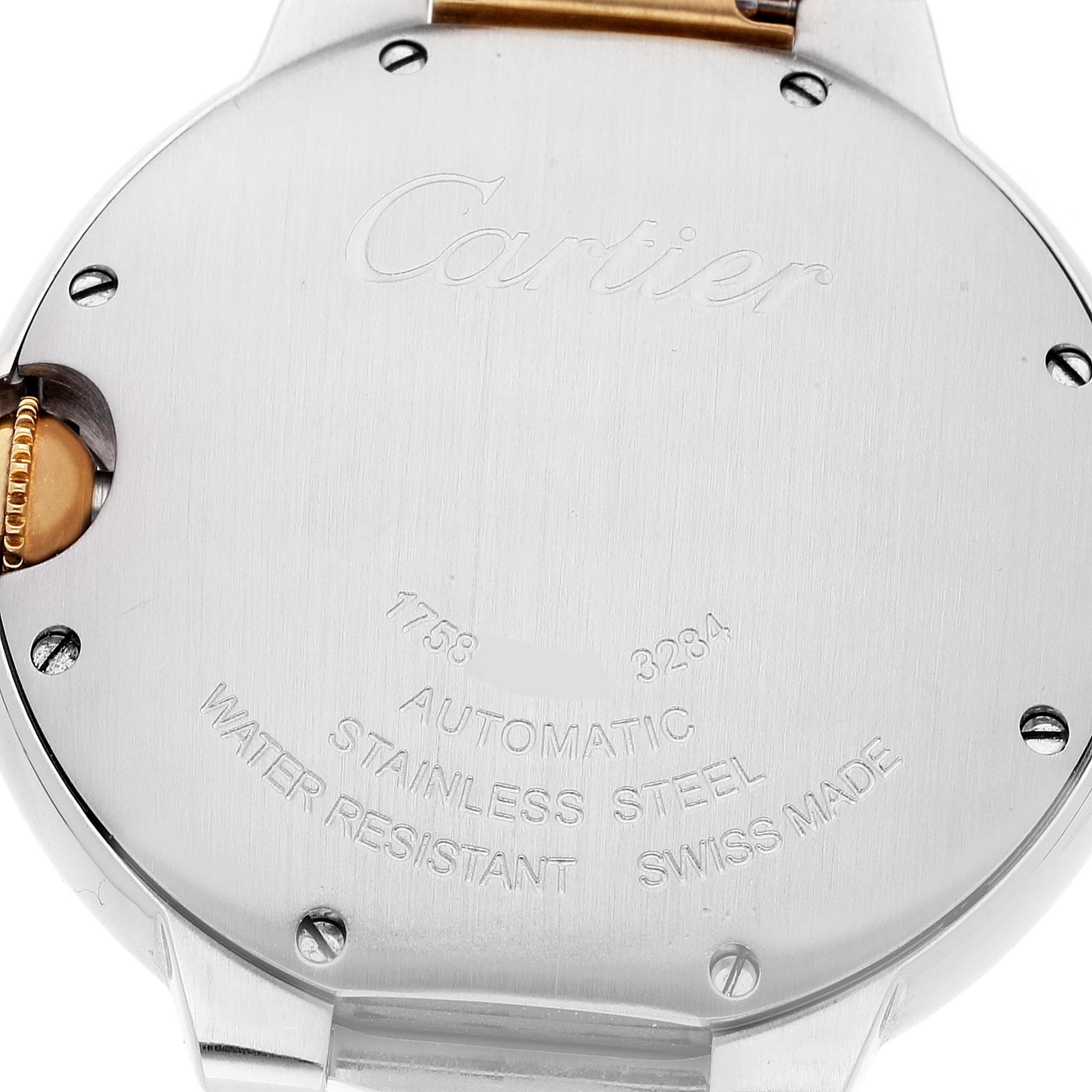 The image shows the back case of a Ballon Bleu model by Cartier, highlighting the stainless steel material and engravings.