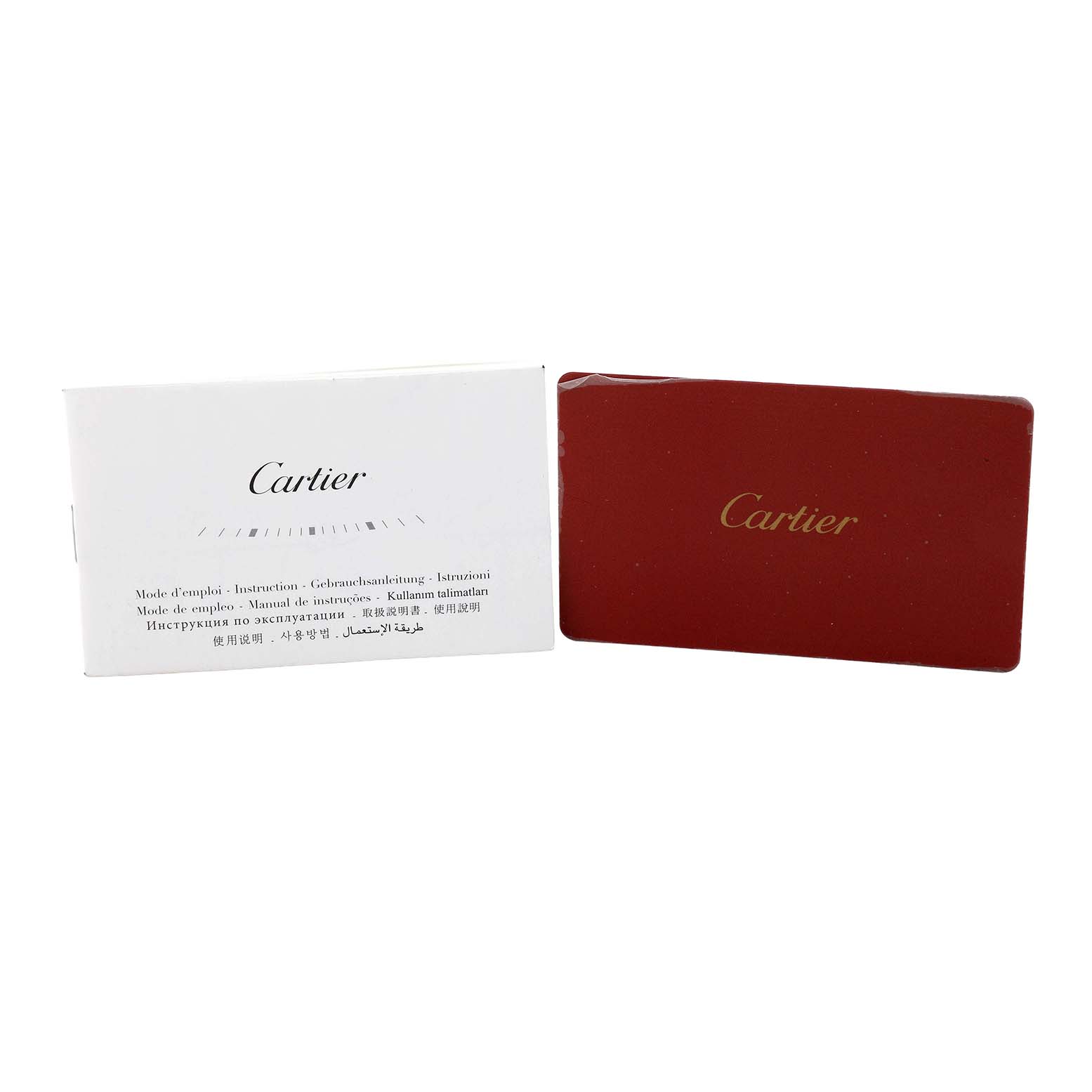 The image shows a red Cartier card and a white instruction booklet for the Cartier Clé watch model.