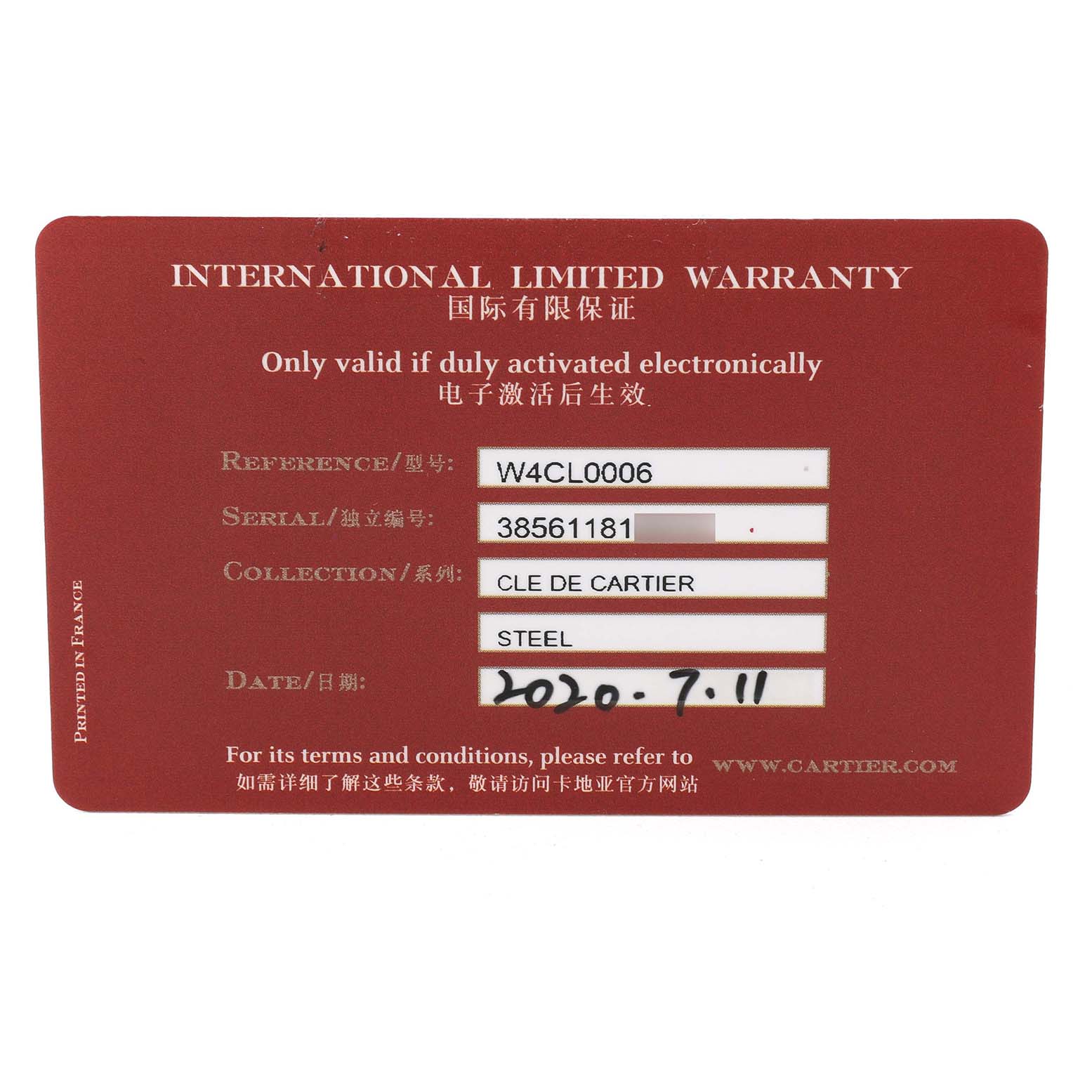 This image shows the Cartier Clé model's International Limited Warranty card from the front, displaying reference and serial numbers.