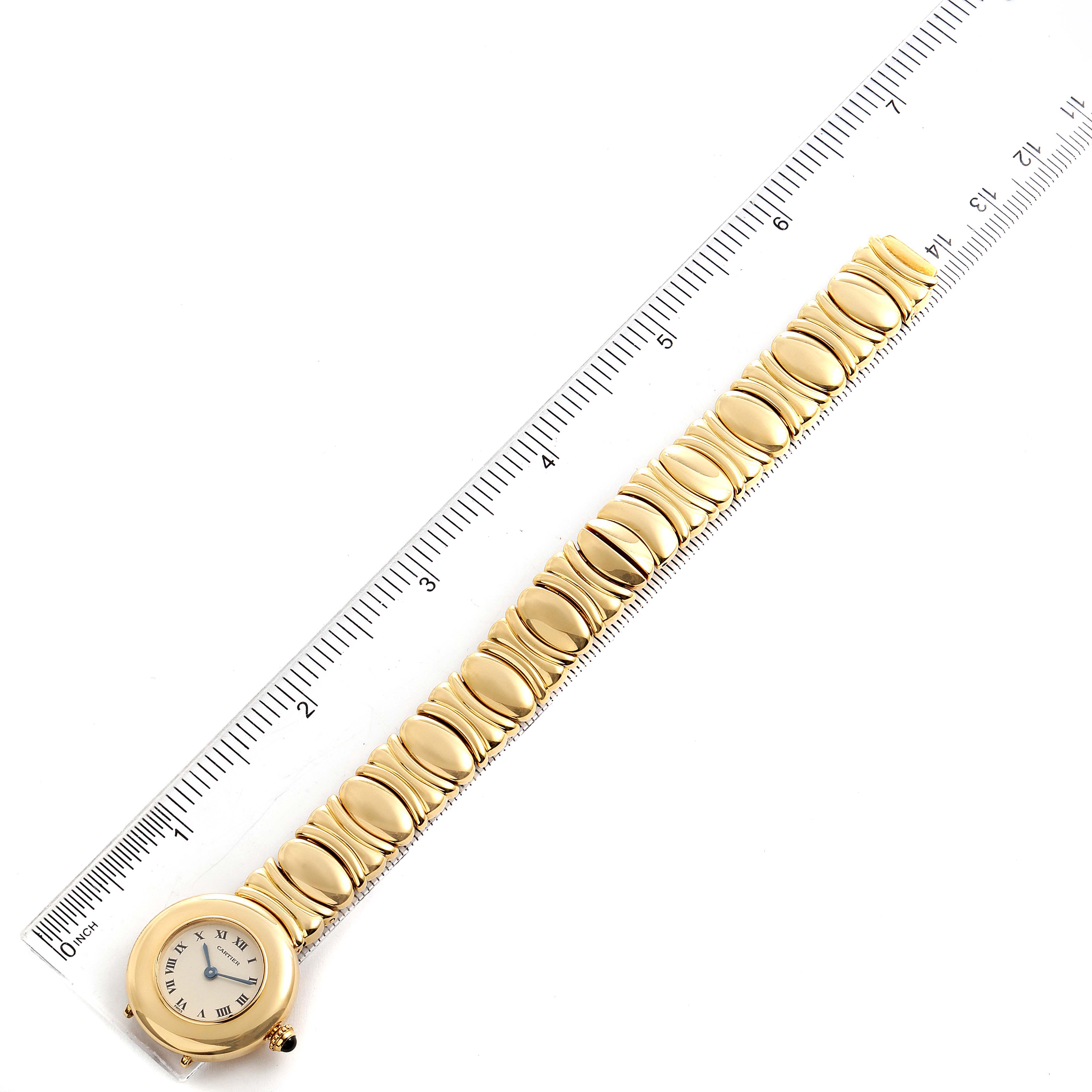 The image shows a Cartier Colisee Women's Yellow Gold Silver Dial Women's Yellow Gold Silver Dial watch laid flat, with a full view of the face, strap, and a ruler for scale.