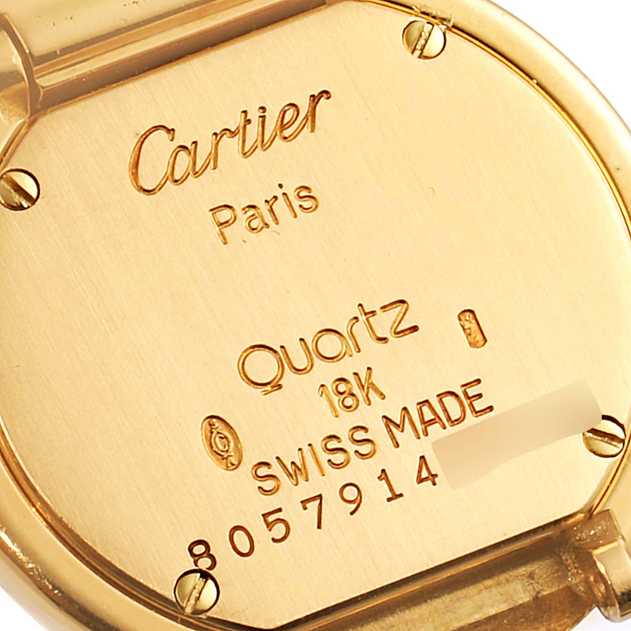 This image shows the back case of a Cartier Colisee Women's Yellow Gold Silver Dial Women's Yellow Gold Silver Dial model watch, including engravings with specifications and serial number.