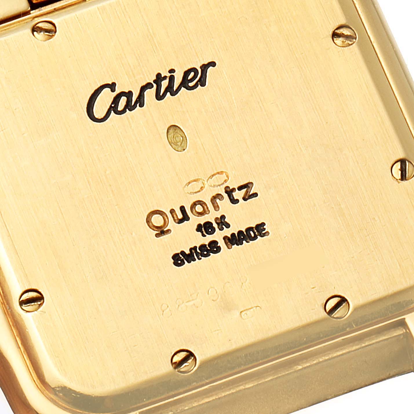 This is the back view of the Cartier Panthere W25014B9 Women's Yellow Gold Silver Dial W25014B9 Women's Yellow Gold Silver Dial watch, showing the brand name, model details, and screws.