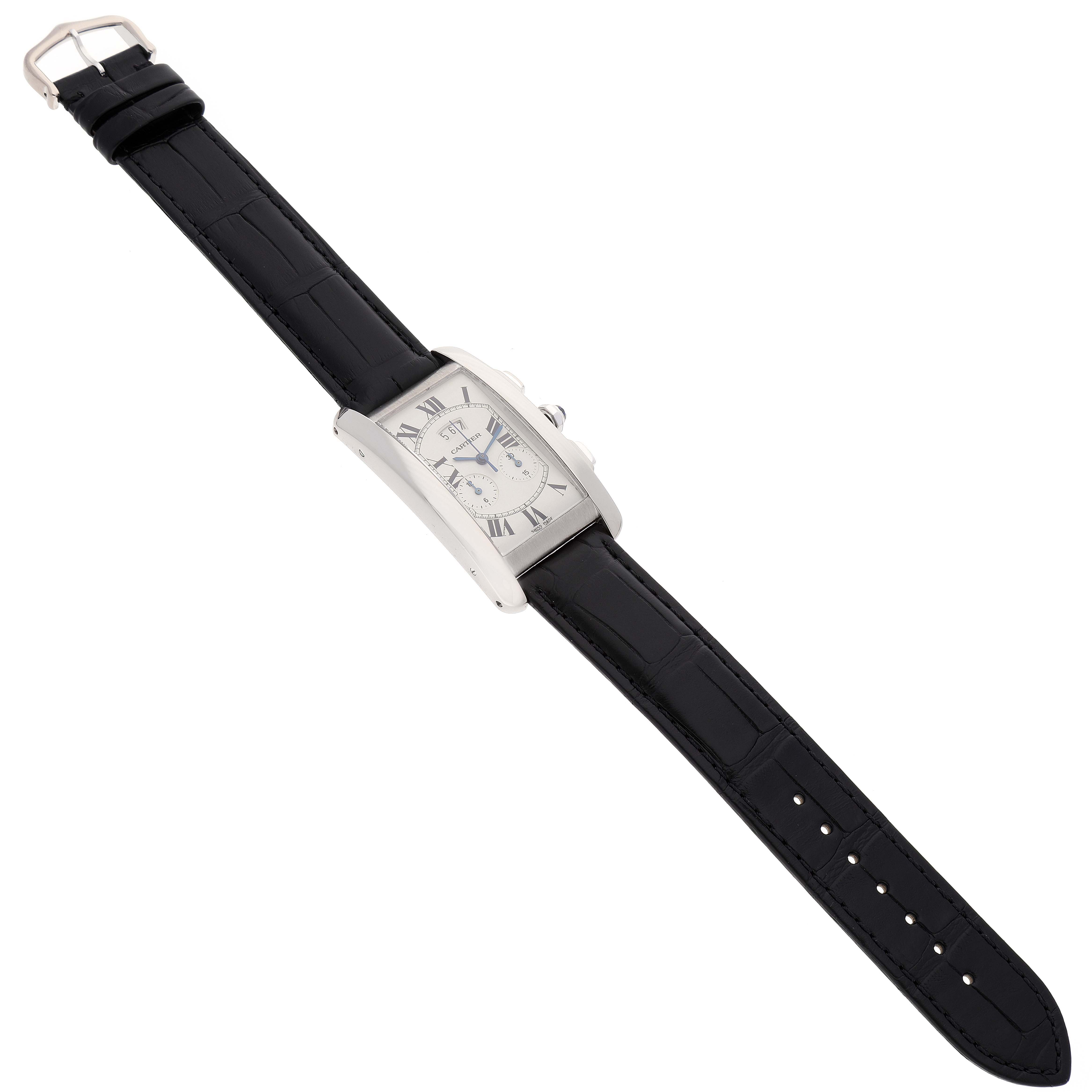 This image shows the Cartier Tank Americaine W2605956 Men's White Gold Silver Dial W2605956 Men's White Gold Silver Dial watch from an overhead angle, including its face, case, and full leather strap.