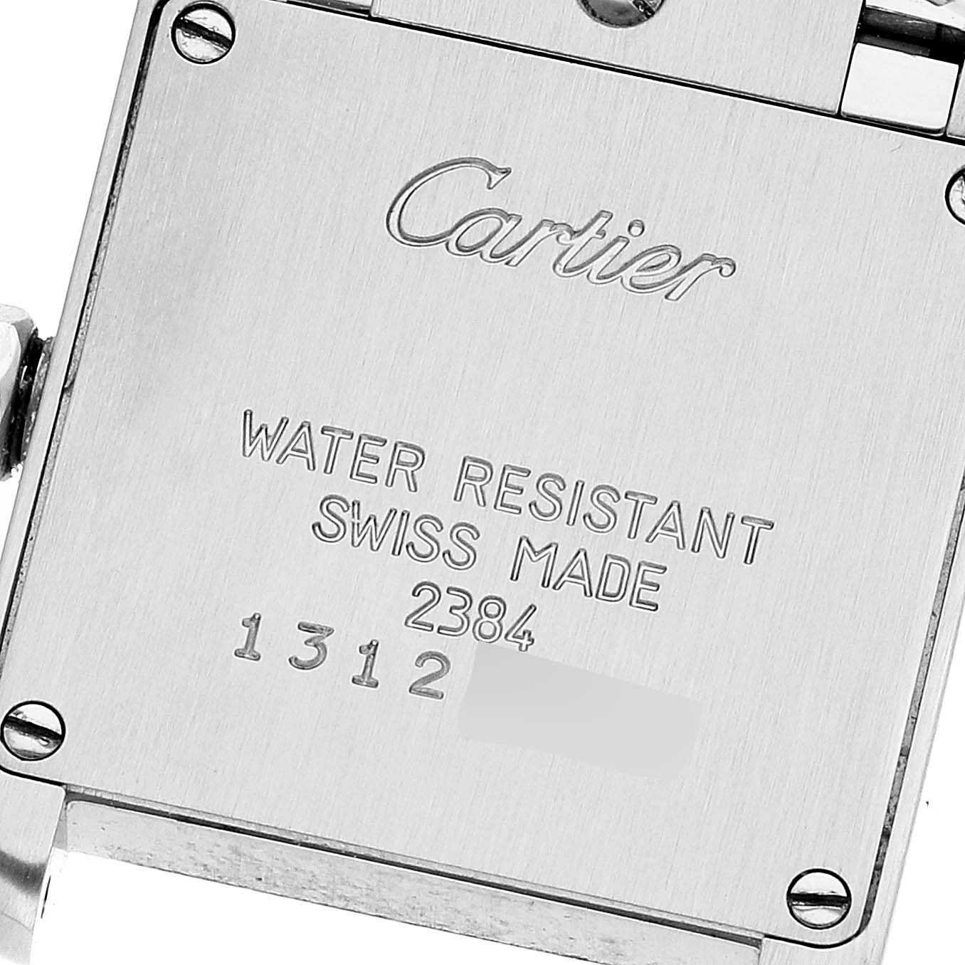 The image shows the back case of a Tank Francaise model by Cartier, highlighting its engravings and screws.