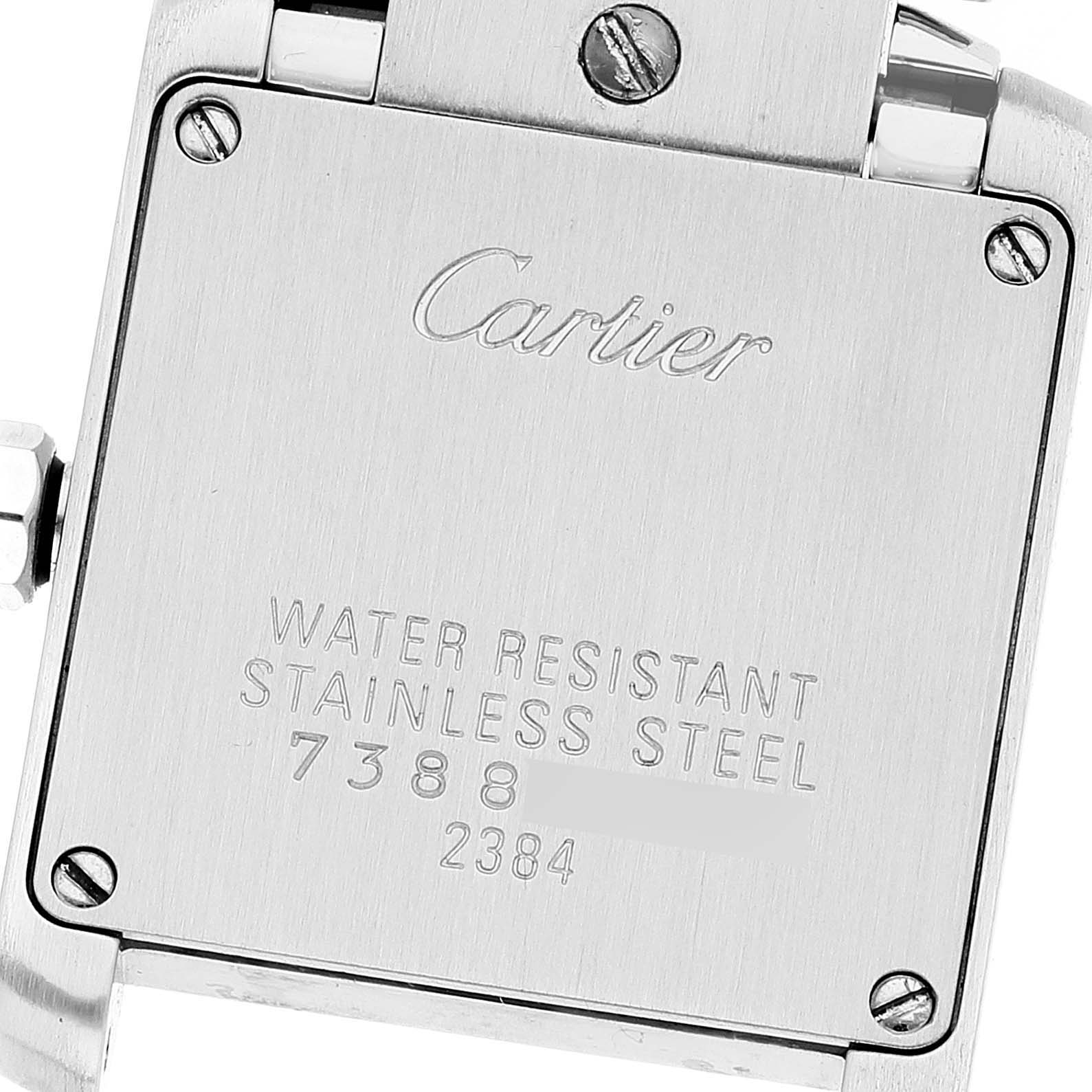 The image shows the back case of a Cartier Tank Française watch, including brand engraving and model information.
