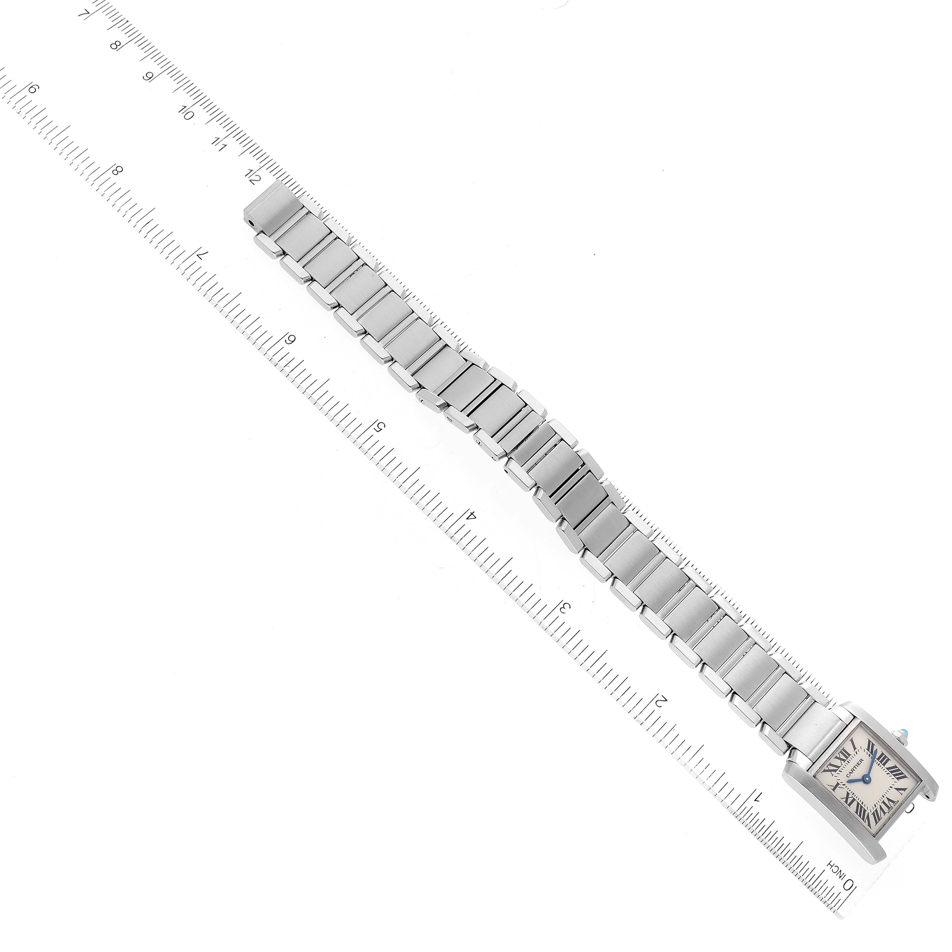 The image shows a Cartier Tank Francaise W51008Q3 Women's Stainless Steel Silver Dial W51008Q3 Women's Stainless Steel Silver Dial watch laid flat, showcasing the watch face and metal bracelet at an angled top-down view.