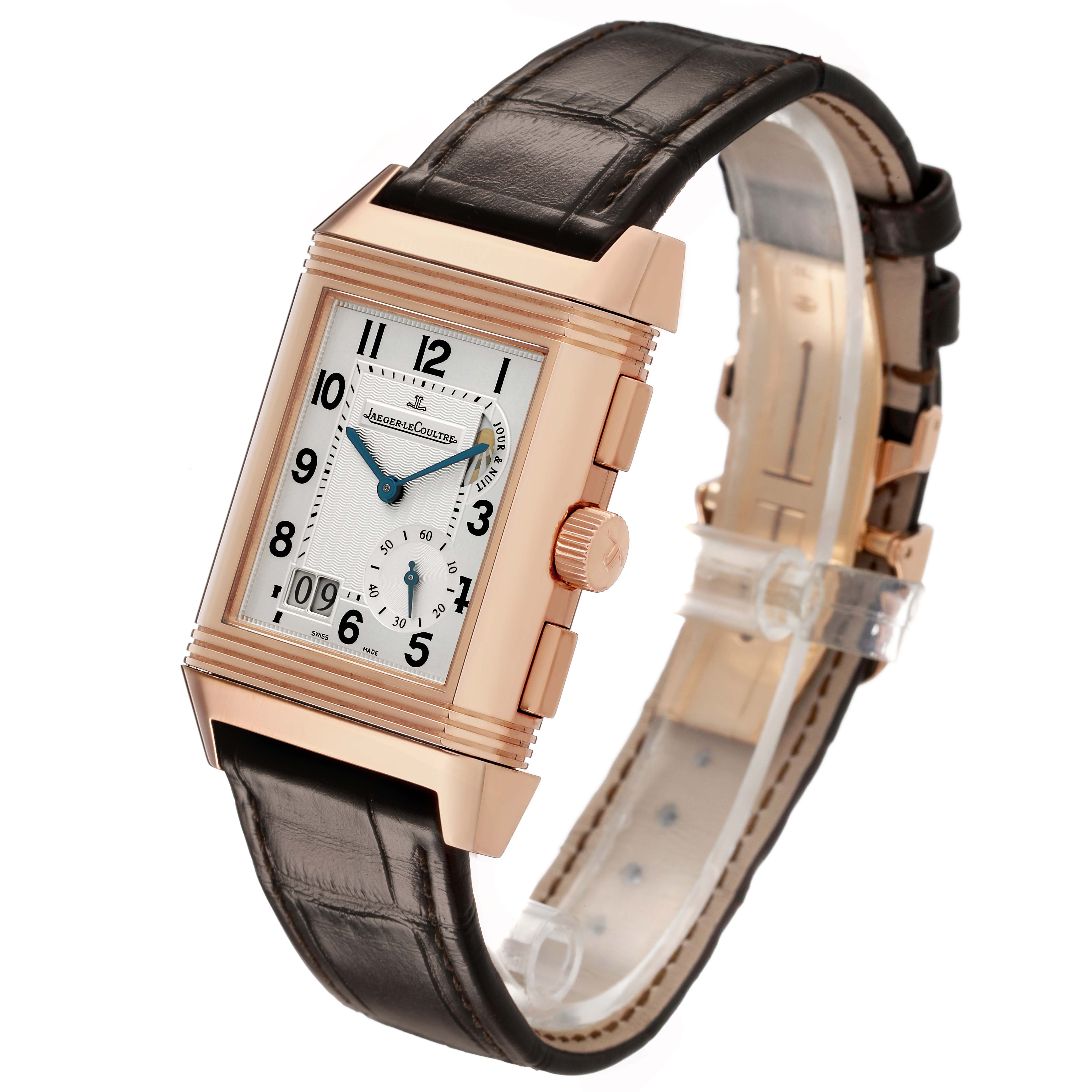 The Jaeger LeCoultre Reverso Q3022420 Men's Rose Gold Silver Dial watch is shown at an angled side view displaying its rectangular case, dial, and leather strap.