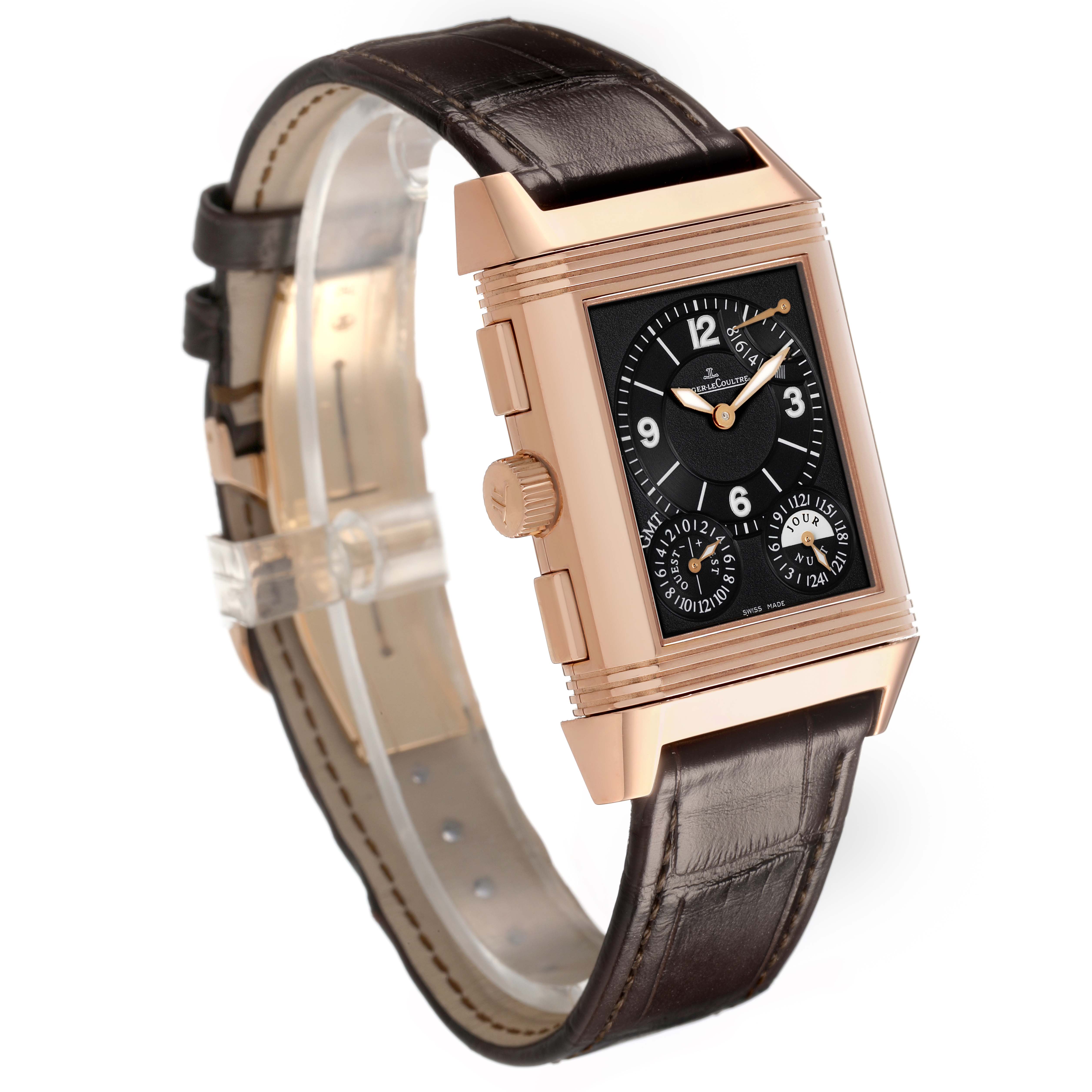 The Jaeger-LeCoultre Reverso watch is shown at a three-quarter angle, highlighting the rectangular face, crown, and brown leather strap.