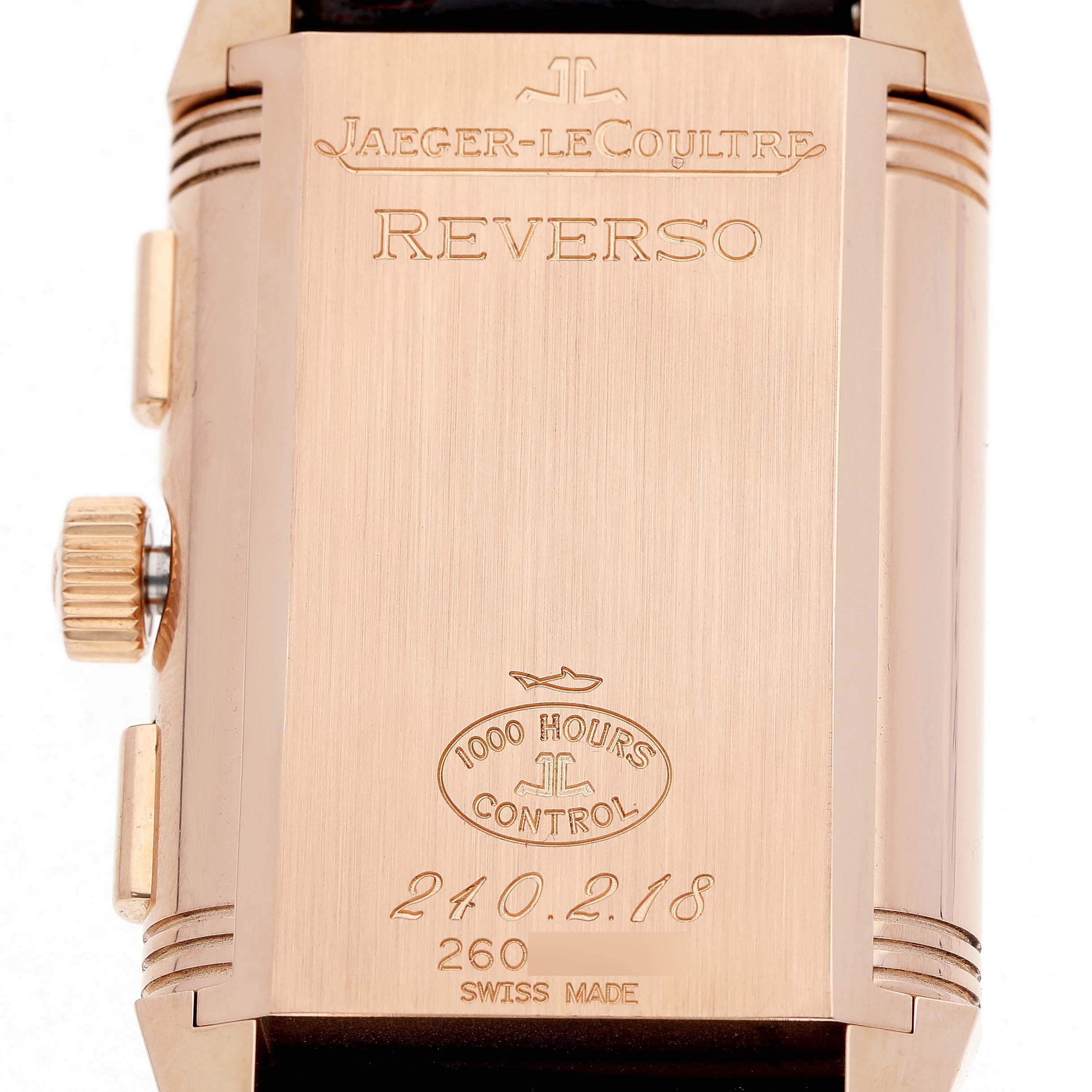 The image shows the back case of the Jaeger LeCoultre Reverso Q3022420 Men's Rose Gold Silver Dial watch, featuring engravings and a side view of the crown.