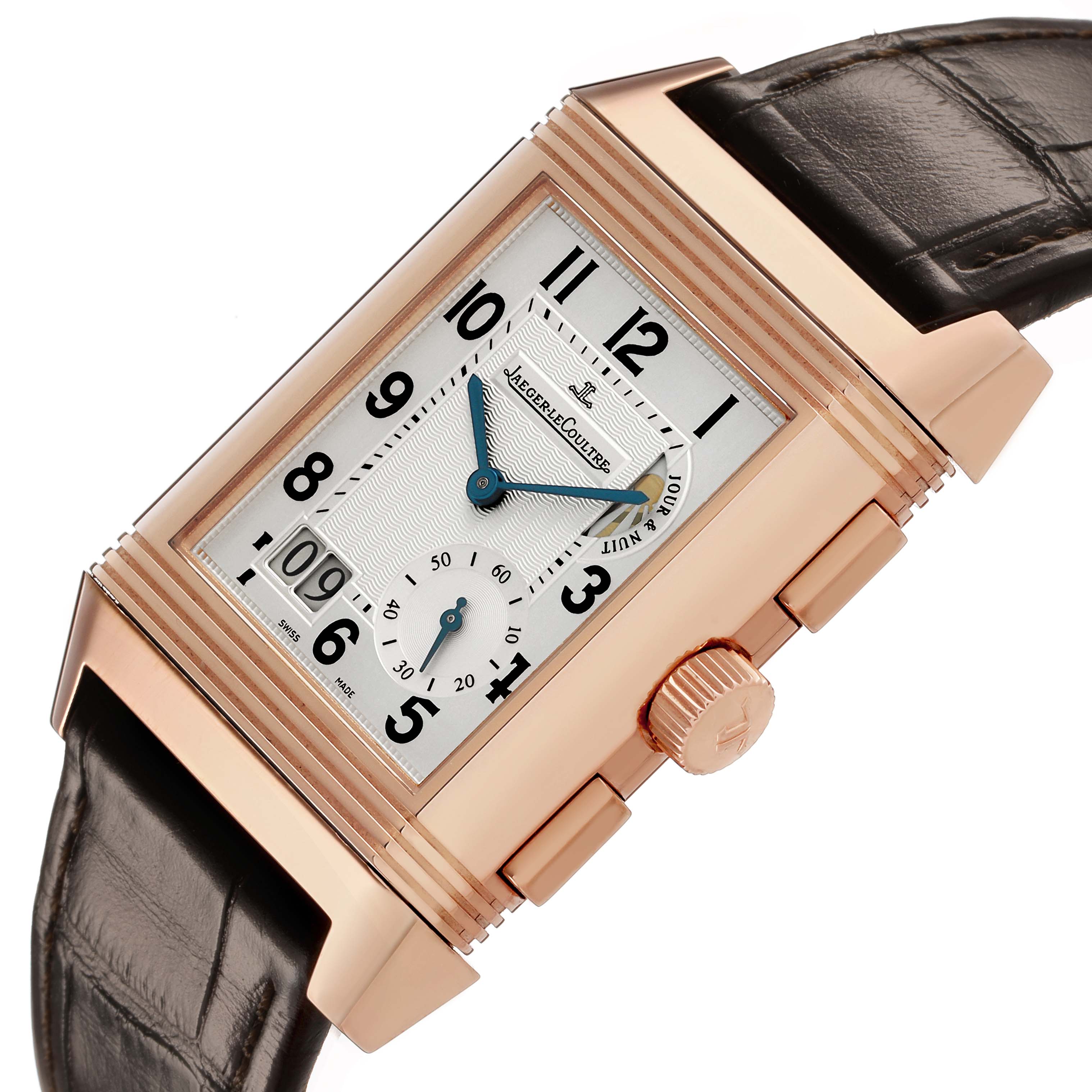 The Jaeger-LeCoultre Reverso watch is shown at a slight angle, revealing its face, crown, and part of the leather strap.