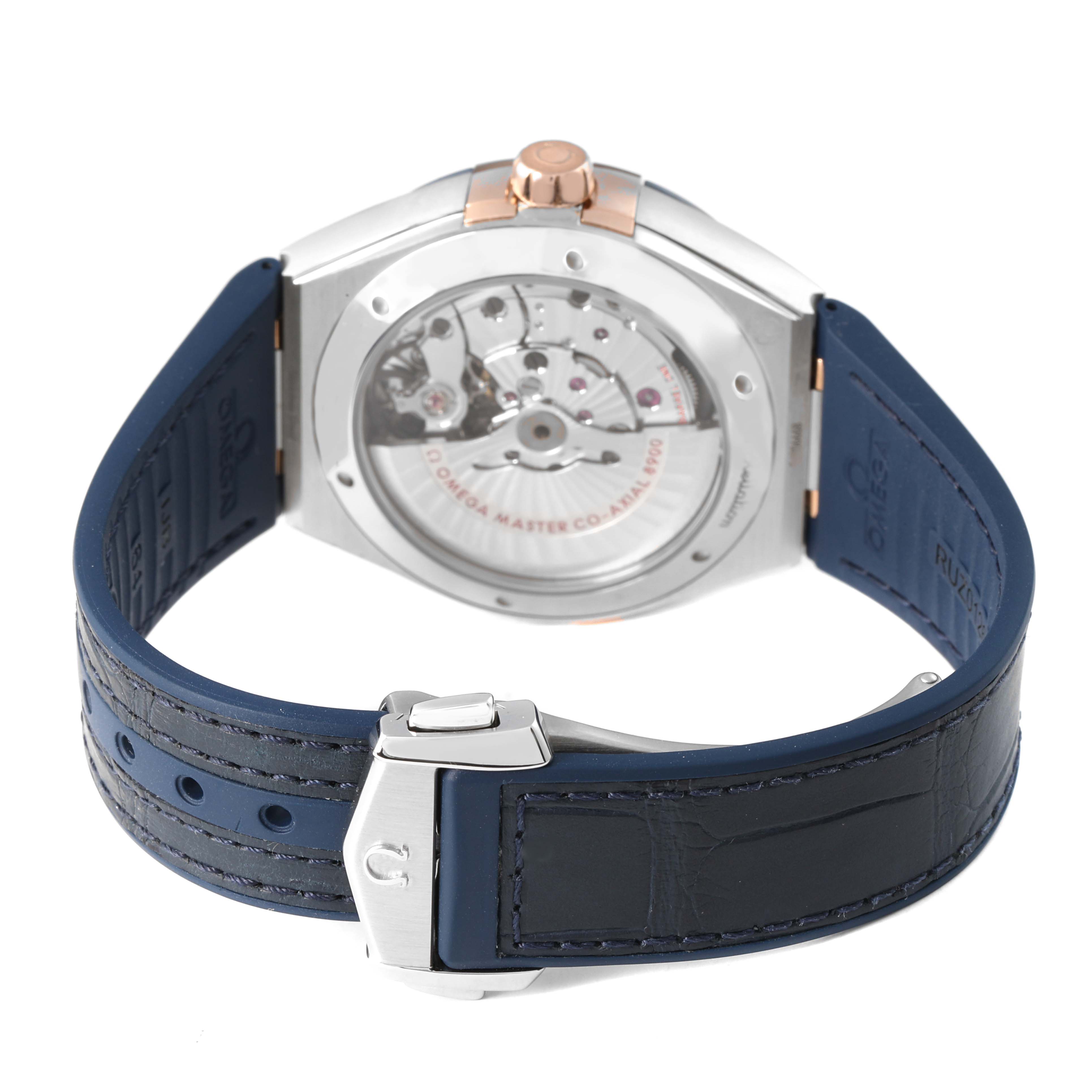 The Omega Constellation 131.23.41.21.03.001 Men's Stainless Steel Blue Dial watch is shown from the back, highlighting the movement through the transparent case back and the dark blue strap.