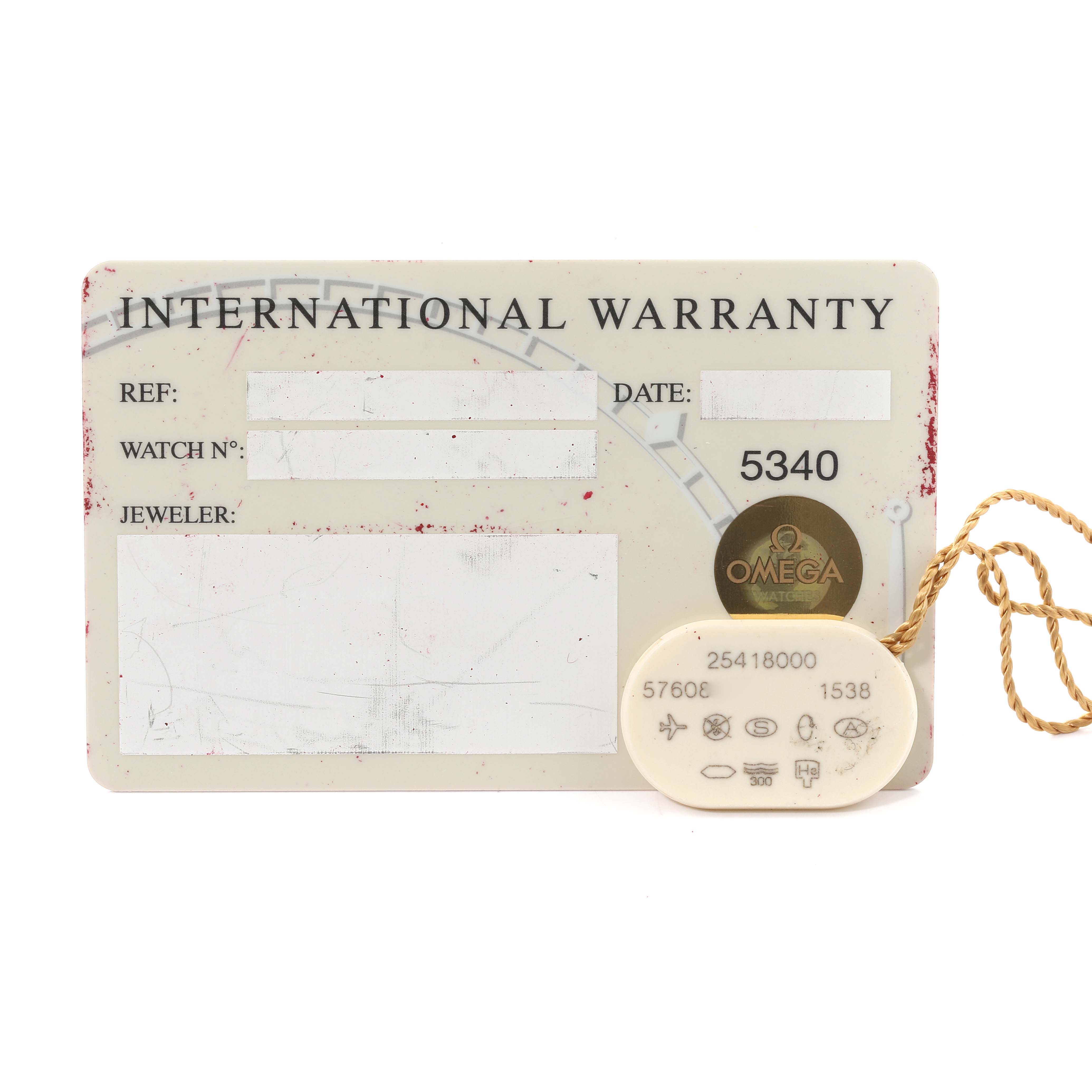 This image shows the international warranty card and an accessory tag for the Omega Seamaster 2541.80.00 Men's Stainless Steel Blue Dial 2541.80.00 Men's Stainless Steel Blue Dial model watch.