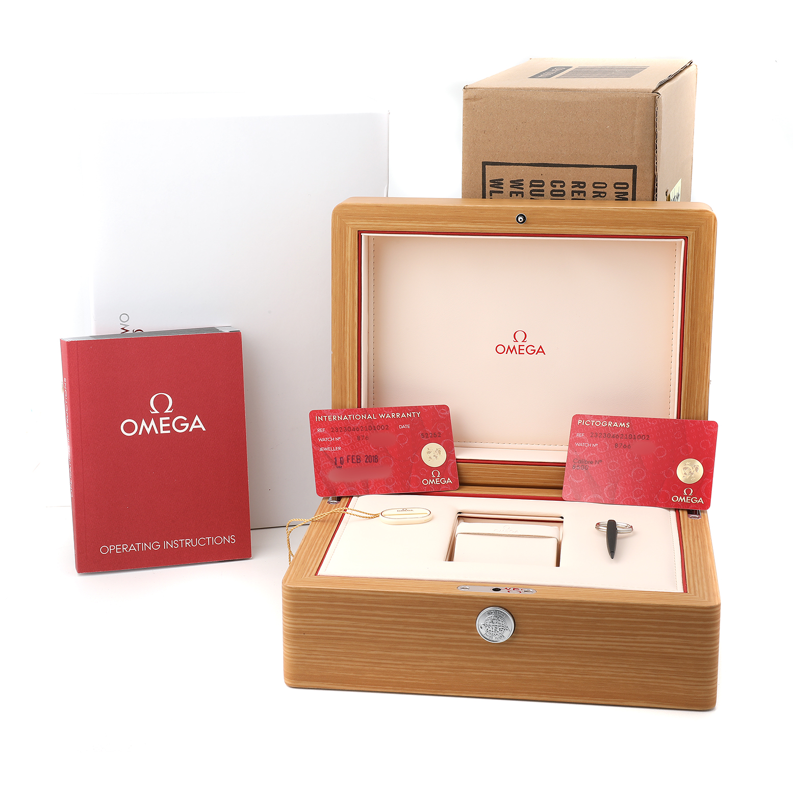 The image shows an Omega Planet Ocean 232.30.46.21.01.002 Men's Stainless Steel Black Dial packaging set with a display box, warranty cards, and instruction manual.