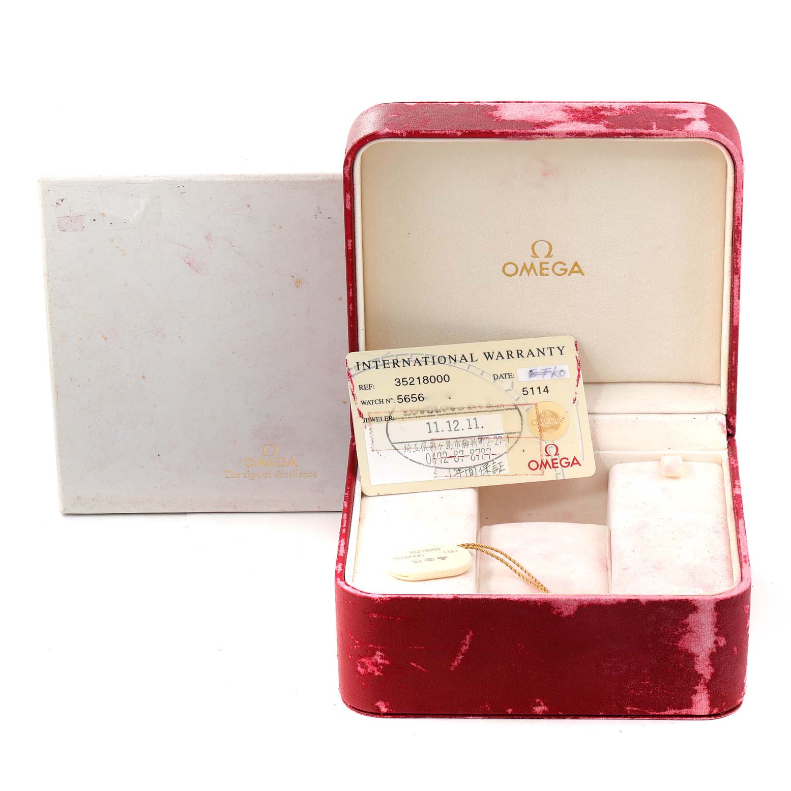 The image shows an Omega Speedmaster 3521.80.00 Men
s Stainless Steel Blue Dial 3521.80.00 Men
s Stainless Steel Blue Dial watch box with an international warranty card; no watch is present.