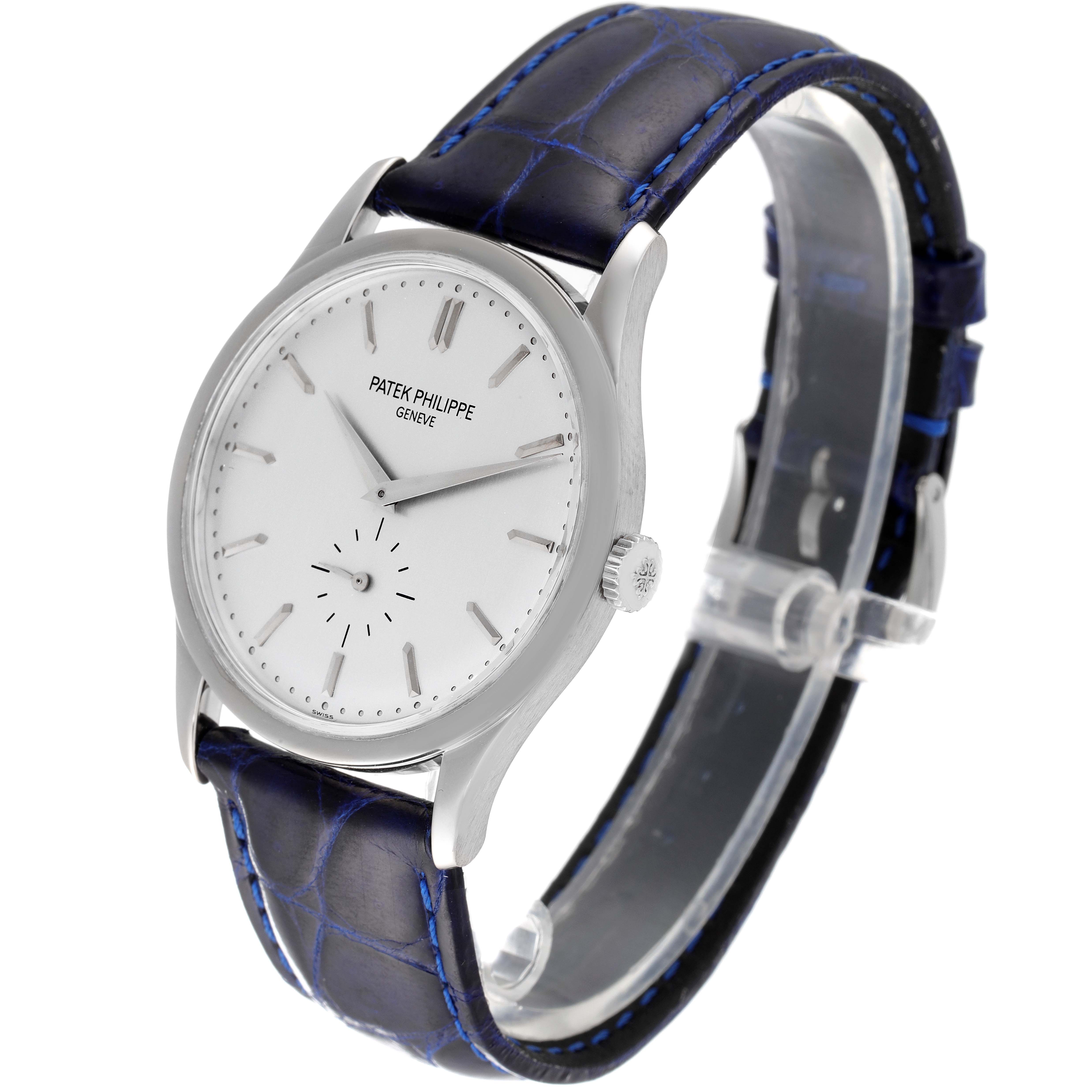 The image shows a Patek Philippe Calatrava 5196G Men's White Gold Silver Dial 5196G Men's White Gold Silver Dial watch, angled to highlight the face, side, and leather strap.