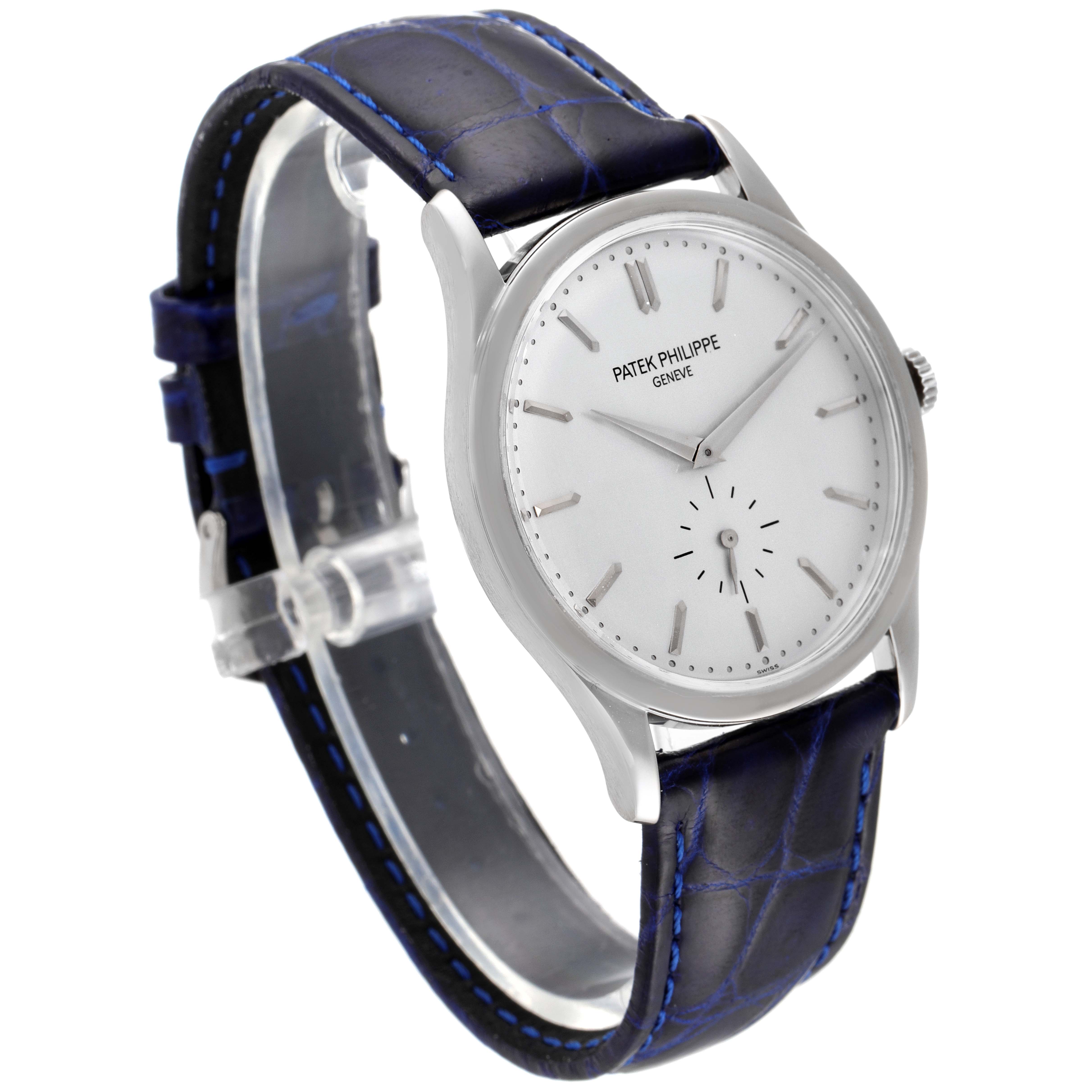 This image shows a Patek Philippe Calatrava 5196G Men's White Gold Silver Dial 5196G Men's White Gold Silver Dial watch at a slight angle, highlighting its face, bezel, crown, and leather strap.