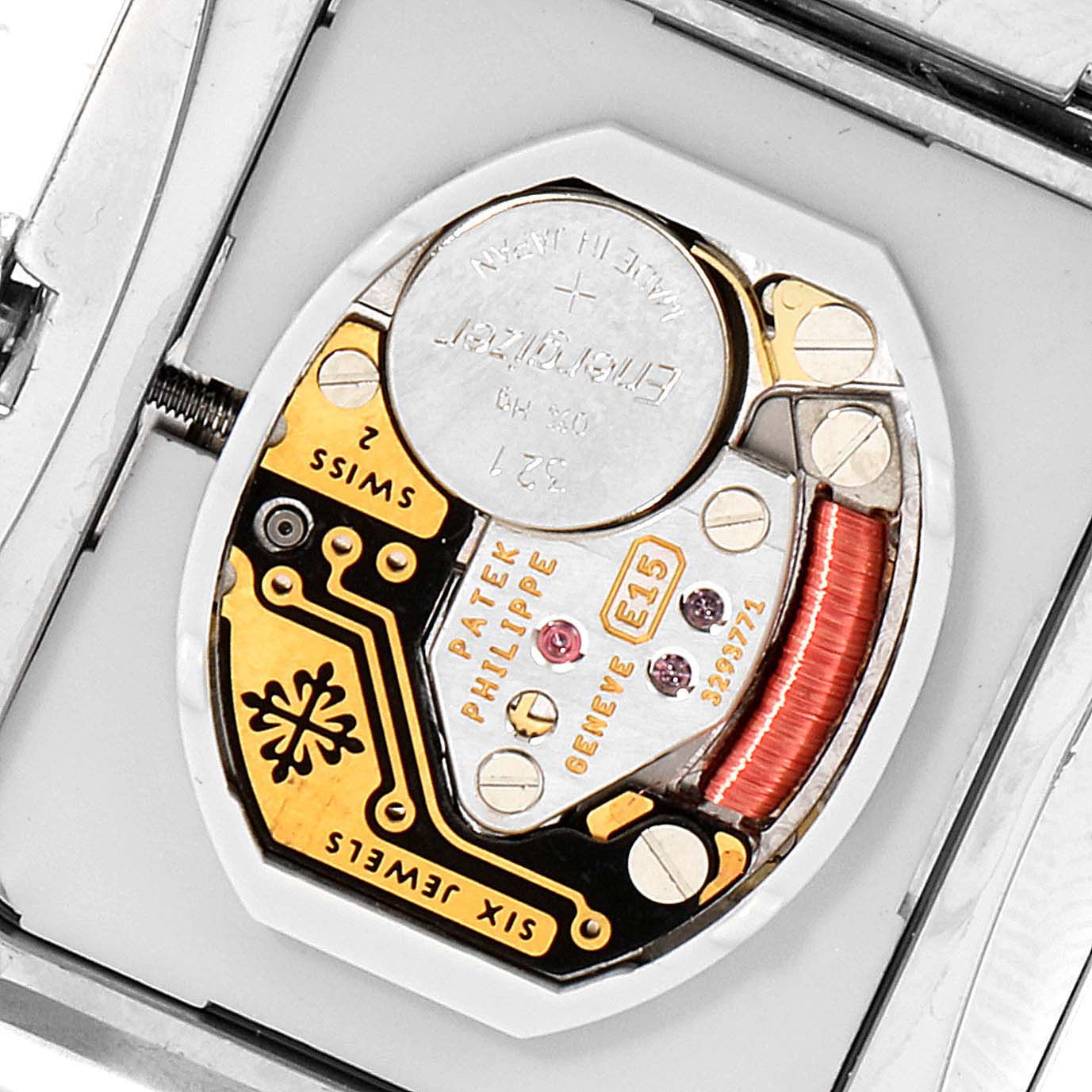 This image shows the internal mechanism of a Patek Philippe Twenty-4 4910/10A-010 Women
s Stainless Steel Grey Dial 4910/10A-010 Women
s Stainless Steel Grey Dial watch, highlighting the battery and circuitry.