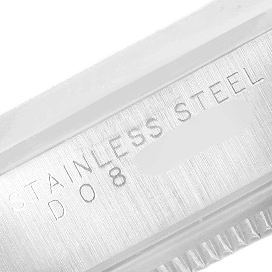 The image shows a close-up of the case back edge of a Rolex Air-King 14000 Men's Stainless Steel Black Dial 14000 Men's Stainless Steel Black Dial watch with "STAINLESS STEEL" engraved.