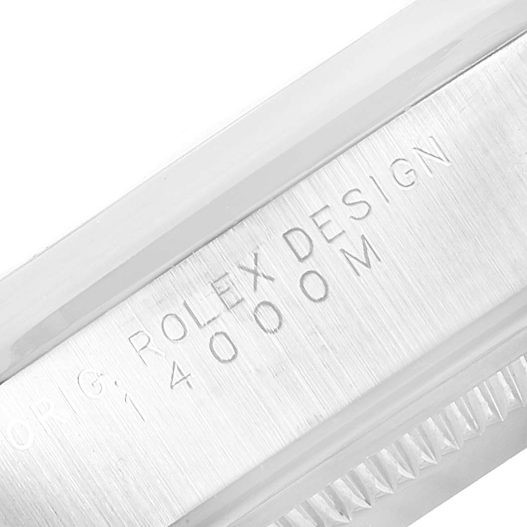 This image shows a close-up of the side engraving on the bezel of a Rolex Air-King 14000 Men's Stainless Steel Black Dial 14000 Men's Stainless Steel Black Dial watch.