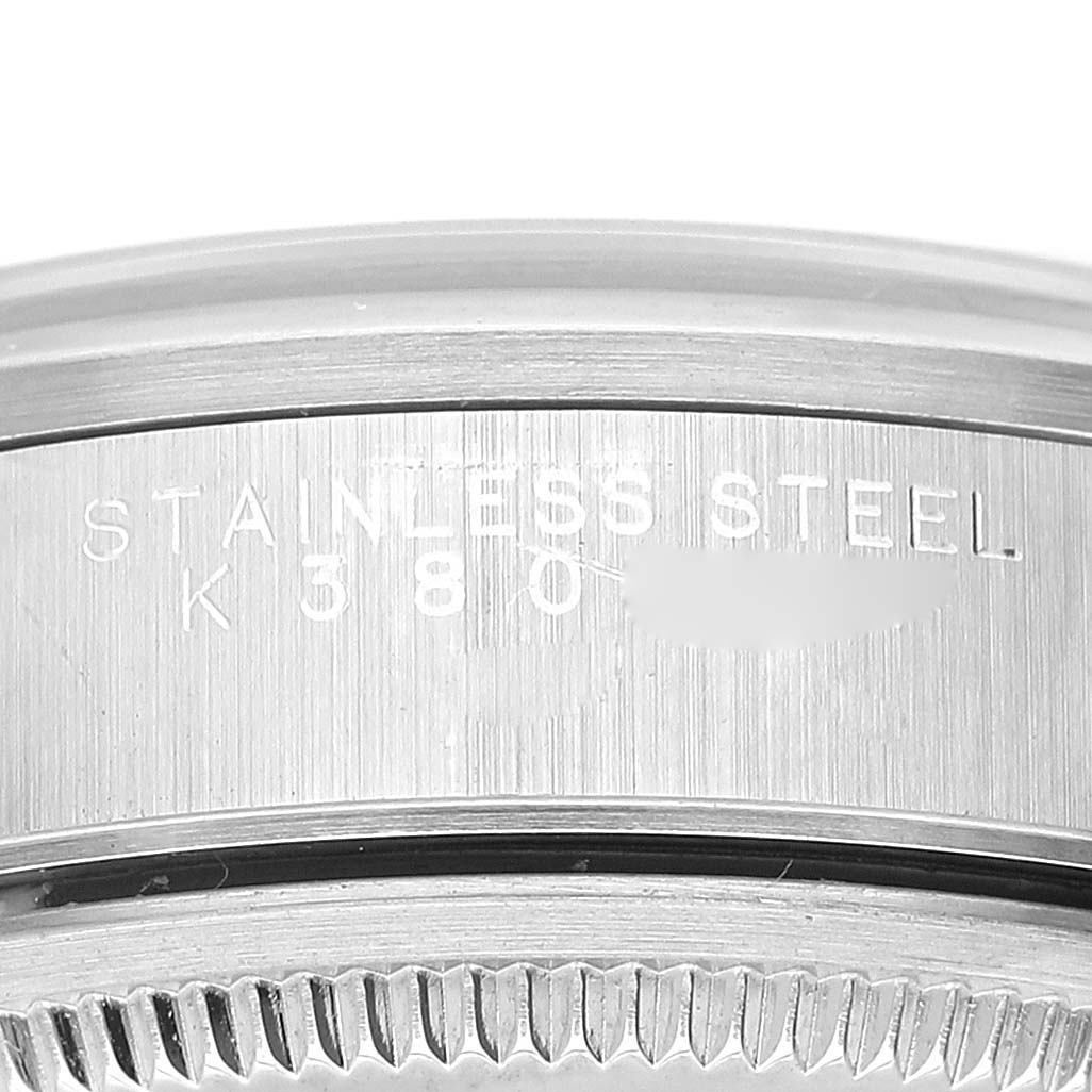 This close-up image shows the side of the bezel and case of a Rolex Air-King 14000 Men's Stainless Steel Blue Dial 14000 Men's Stainless Steel Blue Dial watch, highlighting the engraving.