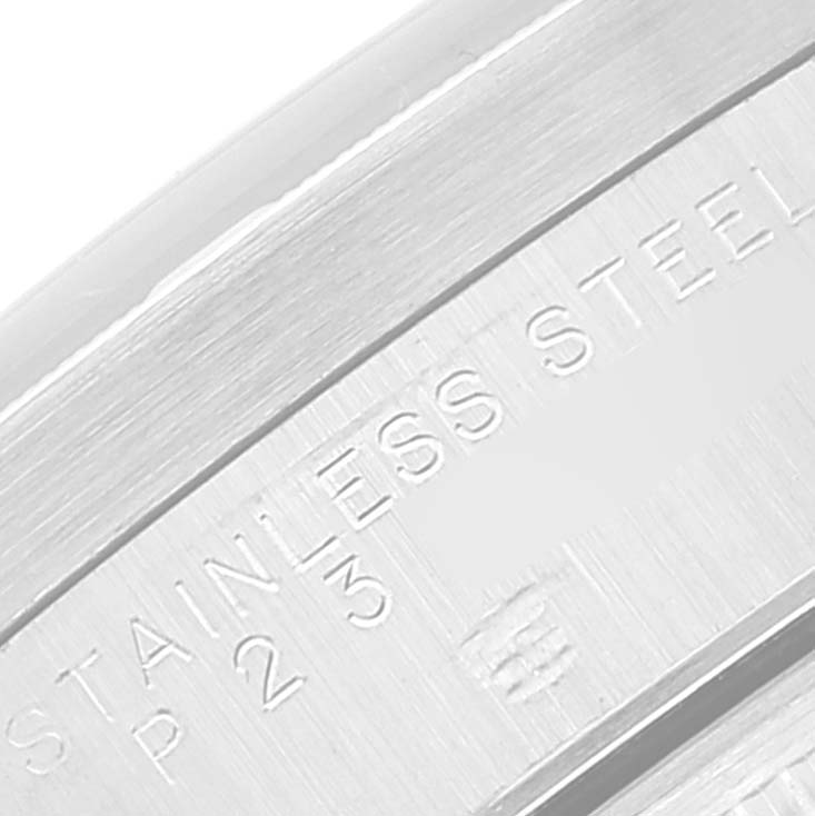 This close-up image shows the stainless steel engraving on the bezel or case back of a Rolex Air-King 14010 Men's Stainless Steel Blue Dial 14010 Men's Stainless Steel Blue Dial watch.