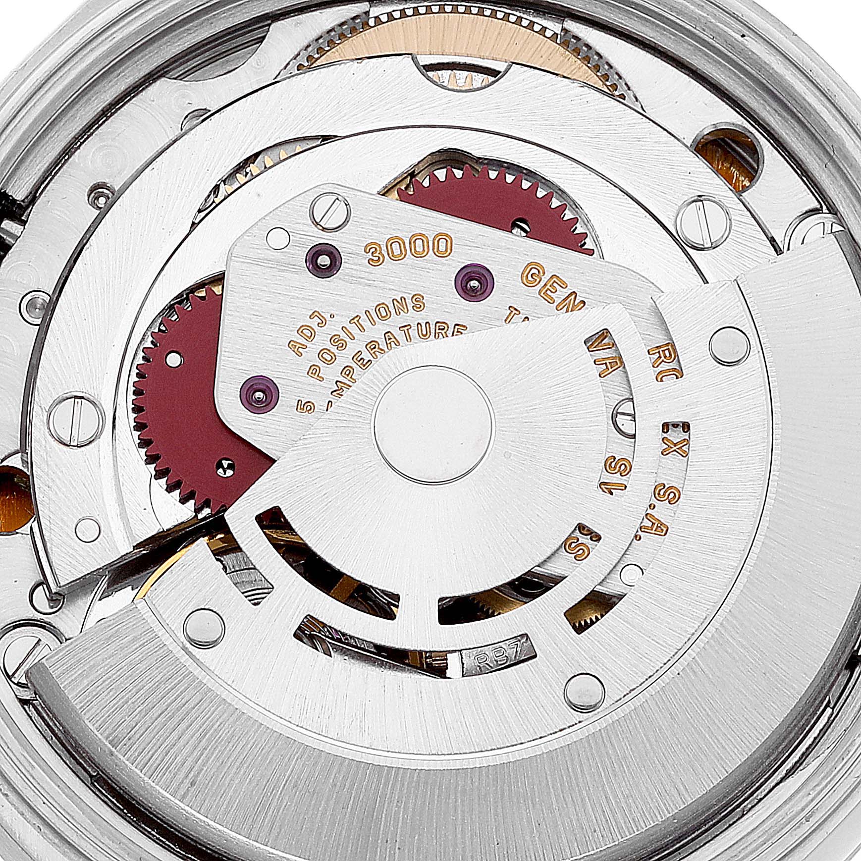 The image shows a close-up view of the movement inside a Rolex Air-King 14010 Men's Stainless Steel Blue Dial 14010 Men's Stainless Steel Blue Dial watch, highlighting gears, cogs, and an intricate mechanism.