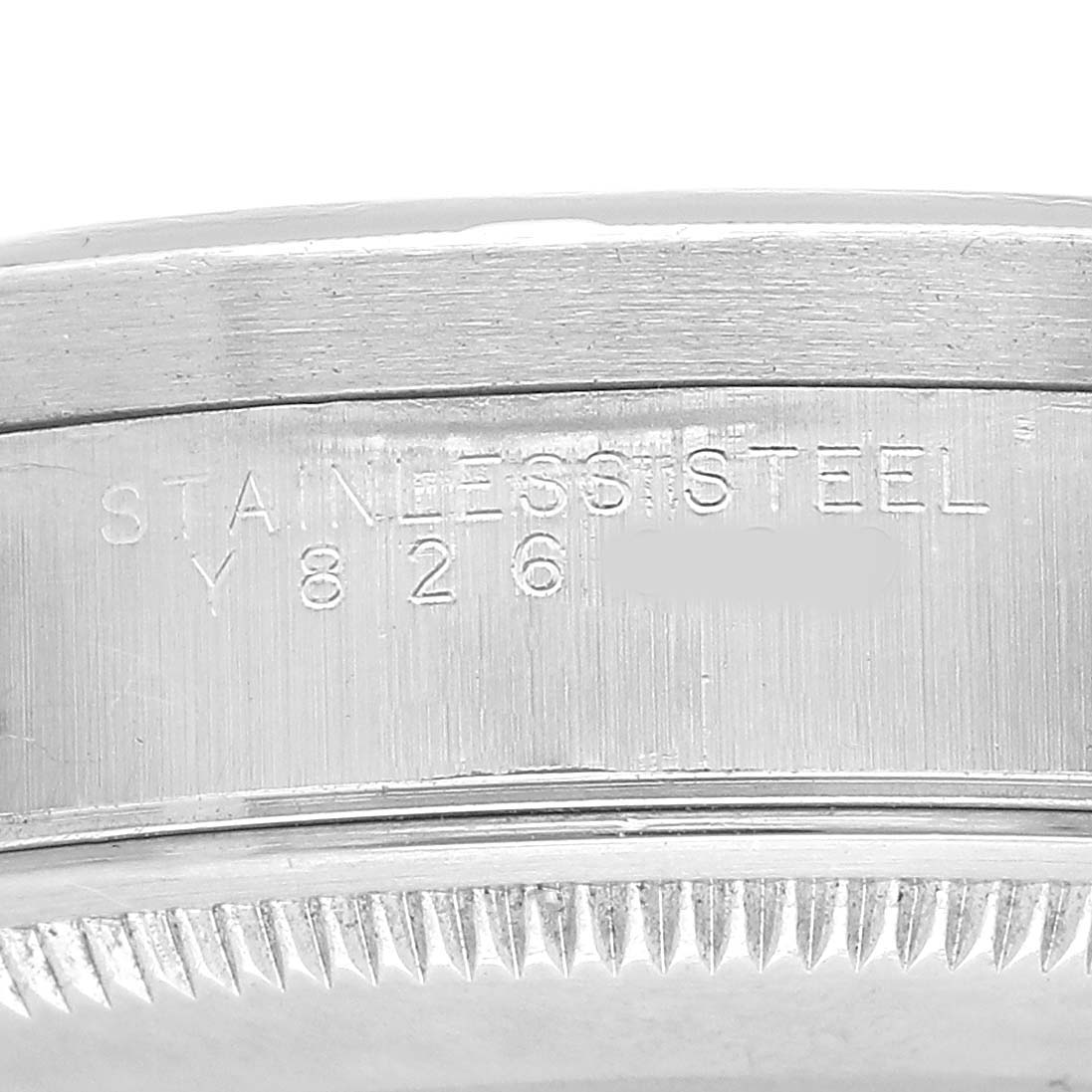 The image shows a close-up of the side of a Rolex Air-King 14010 Men's Stainless Steel Blue Dial watch, highlighting the stainless steel case with engraved markings.