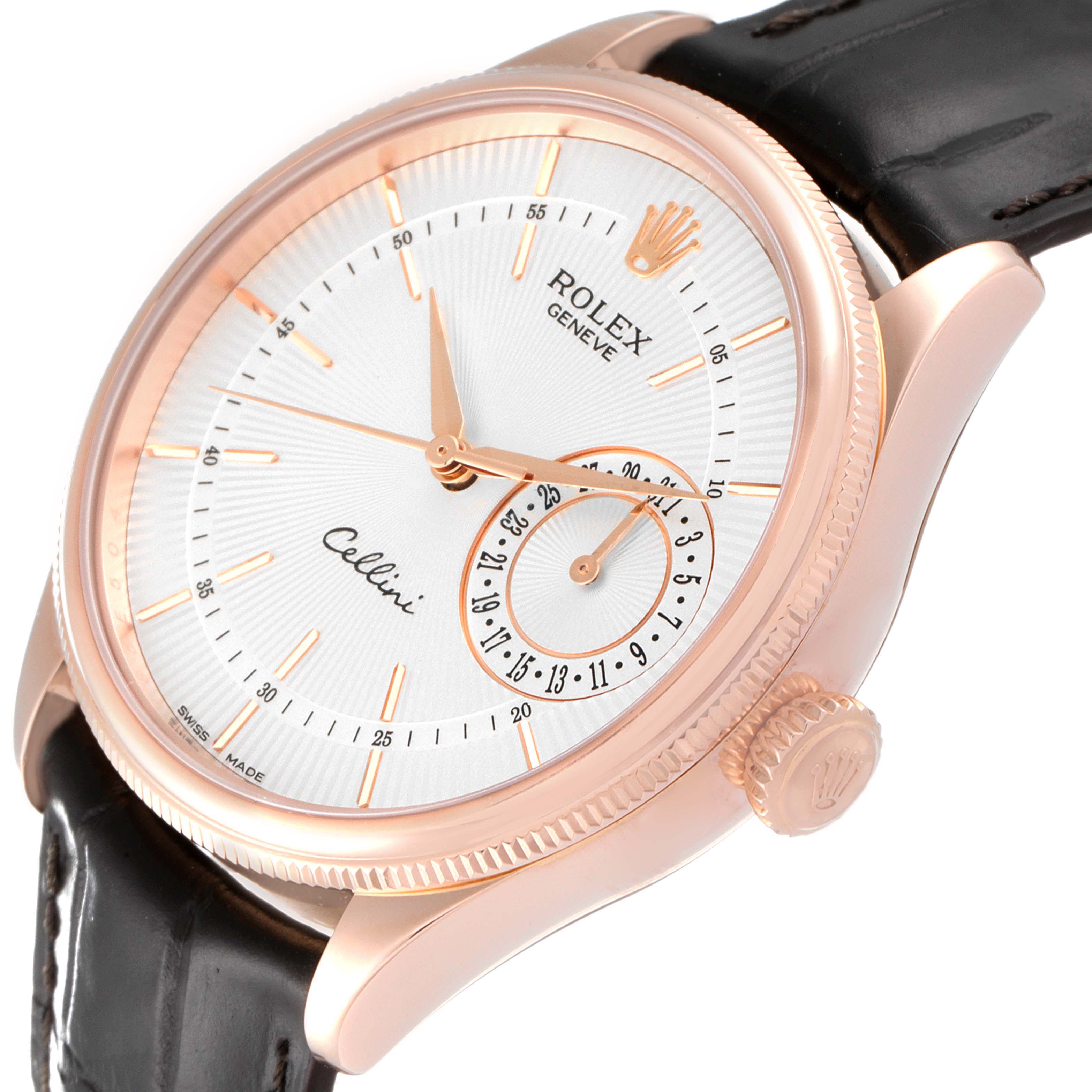 The Rolex Cellini 50515 Men's Rose Gold Silver Dial 50515 Men's Rose Gold Silver Dial watch is shown at an angled view, highlighting its dial, crown, and leather strap.