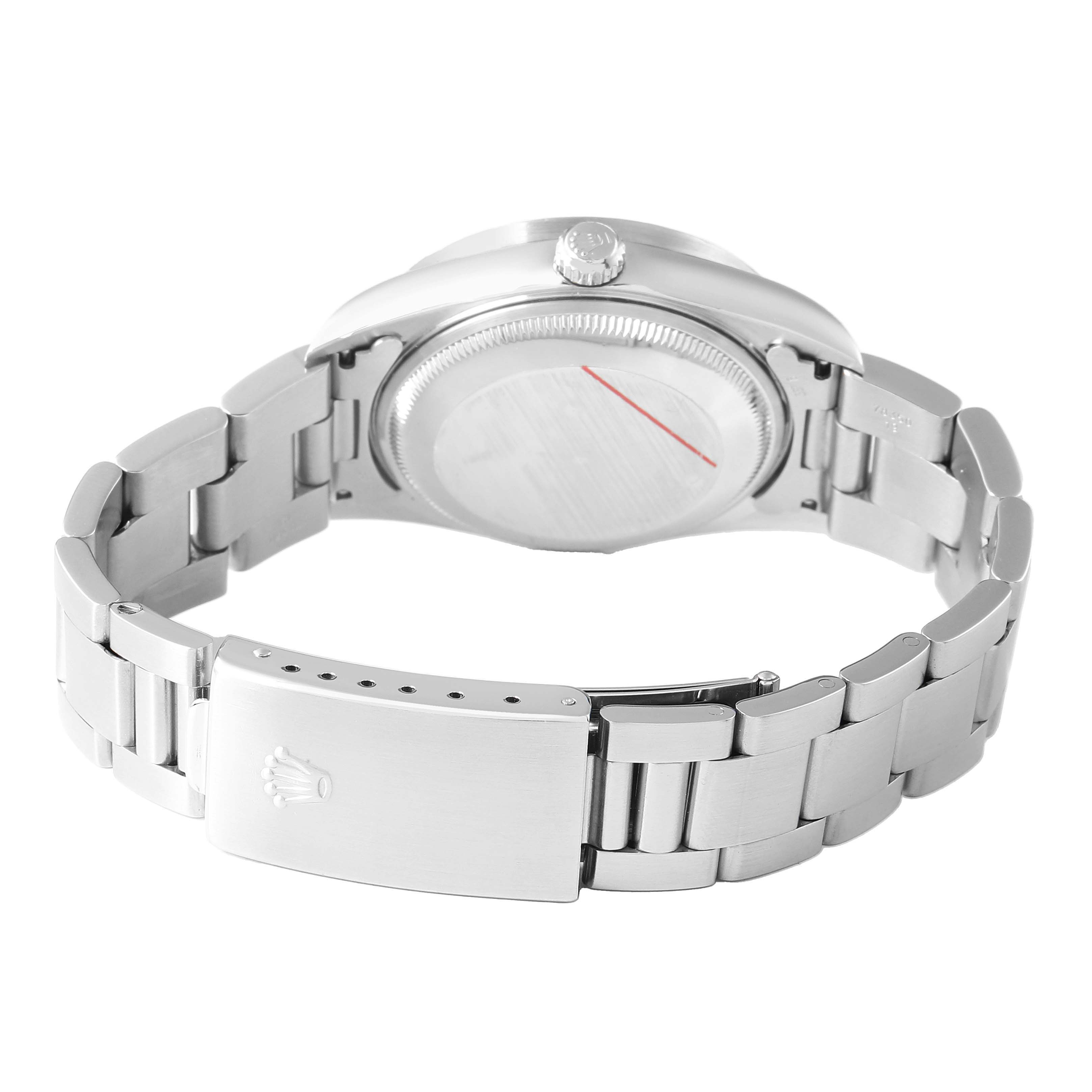 The image shows the back view of a Rolex Date 15210 Men's Stainless Steel Blue Dial model watch, highlighting the bracelet, clasp, and case back.