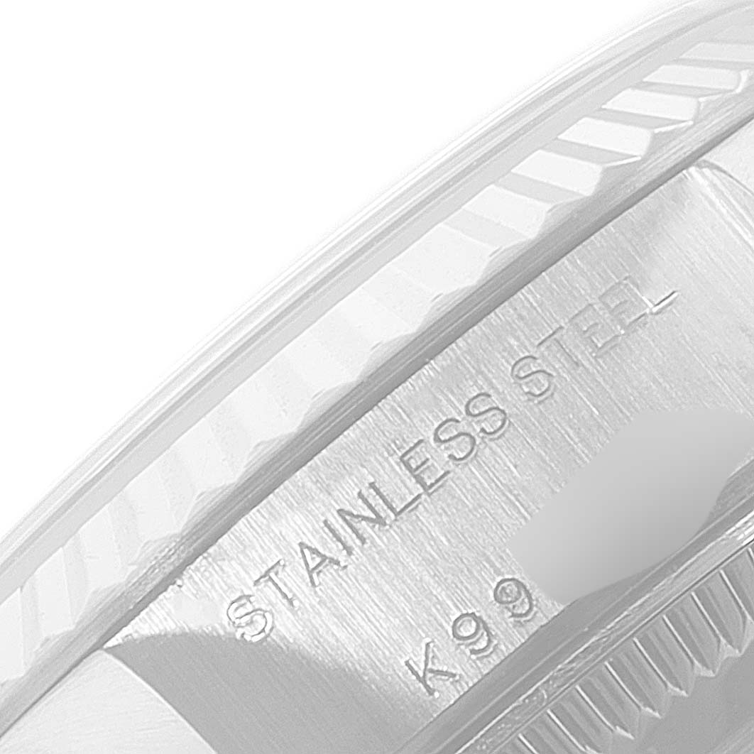 The close-up image shows the stainless steel case with engravings on a Rolex Datejust 79174 Women's Stainless Steel Black Dial 79174 Women's Stainless Steel Black Dial watch.